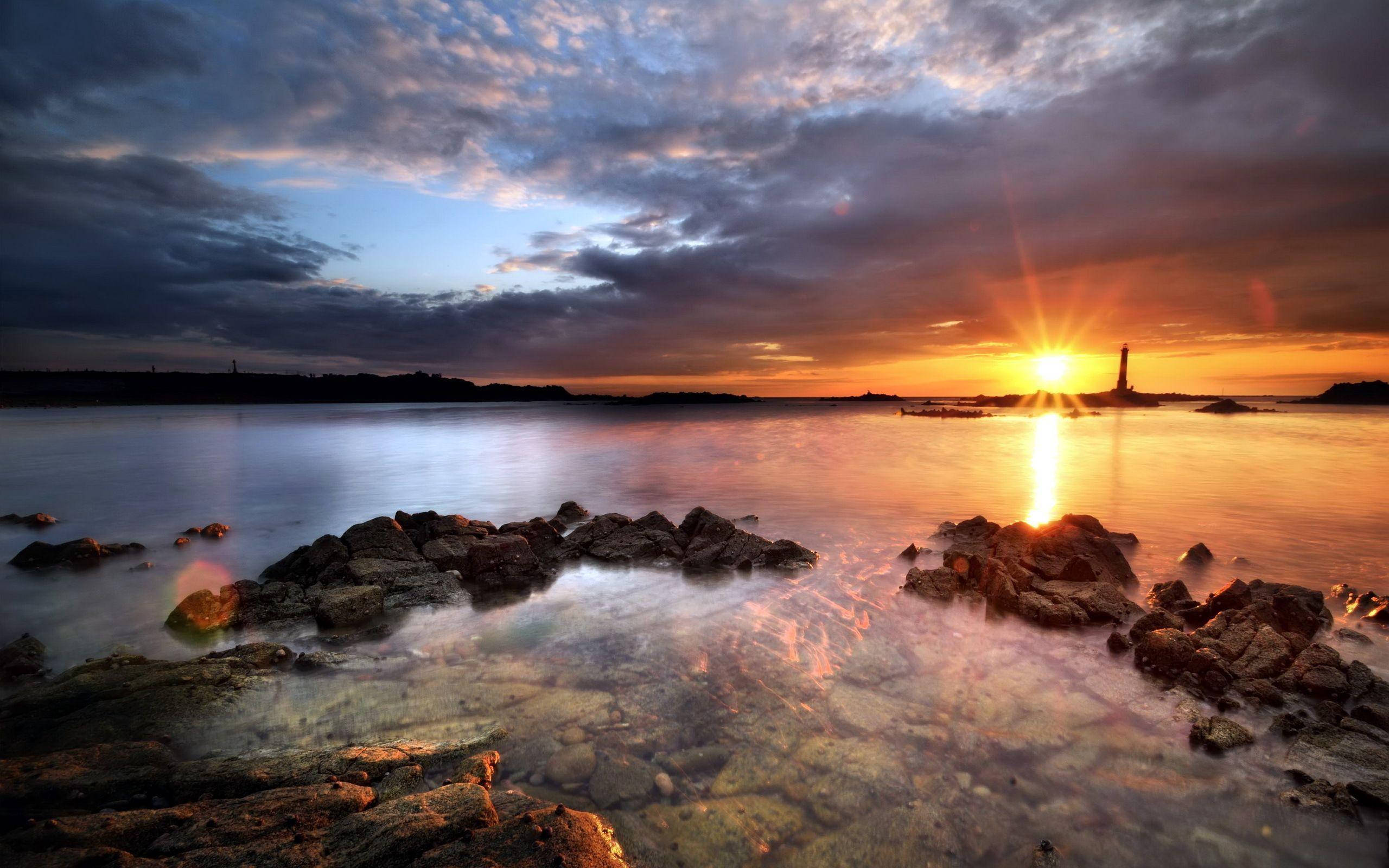 Lighthouse, Sunset, rocky shoreline, 2K Desktop Wallpaper