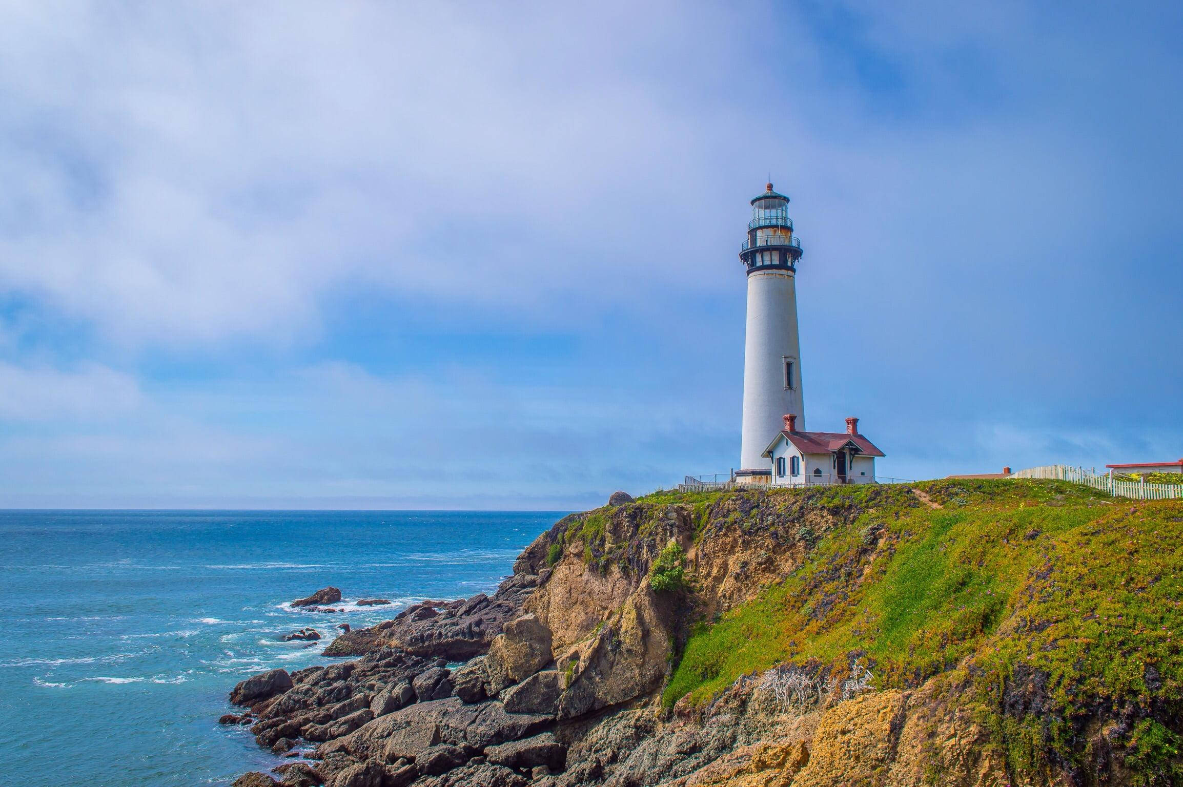 pristine white lighthouse, grassy cliff, deep blue ocean, Full HD Desktop Wallpaper