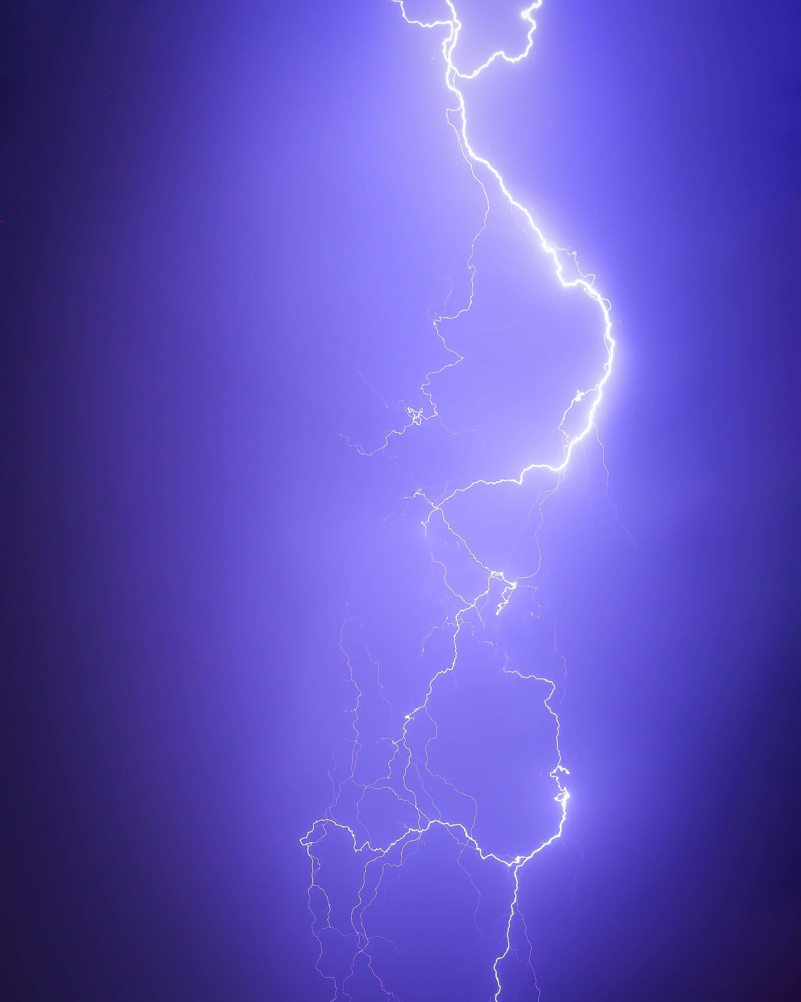 intense electric lightning strike, jagged lightning bolt, deep purple storm sky, 2K Phone Wallpaper