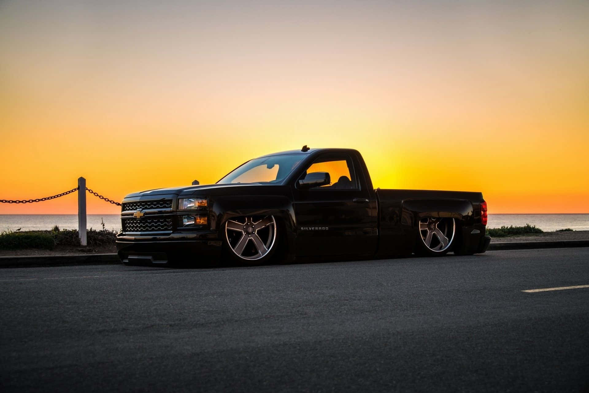 custom lowered truck, sunset silhouette, coastal road, Full HD Desktop Wallpaper