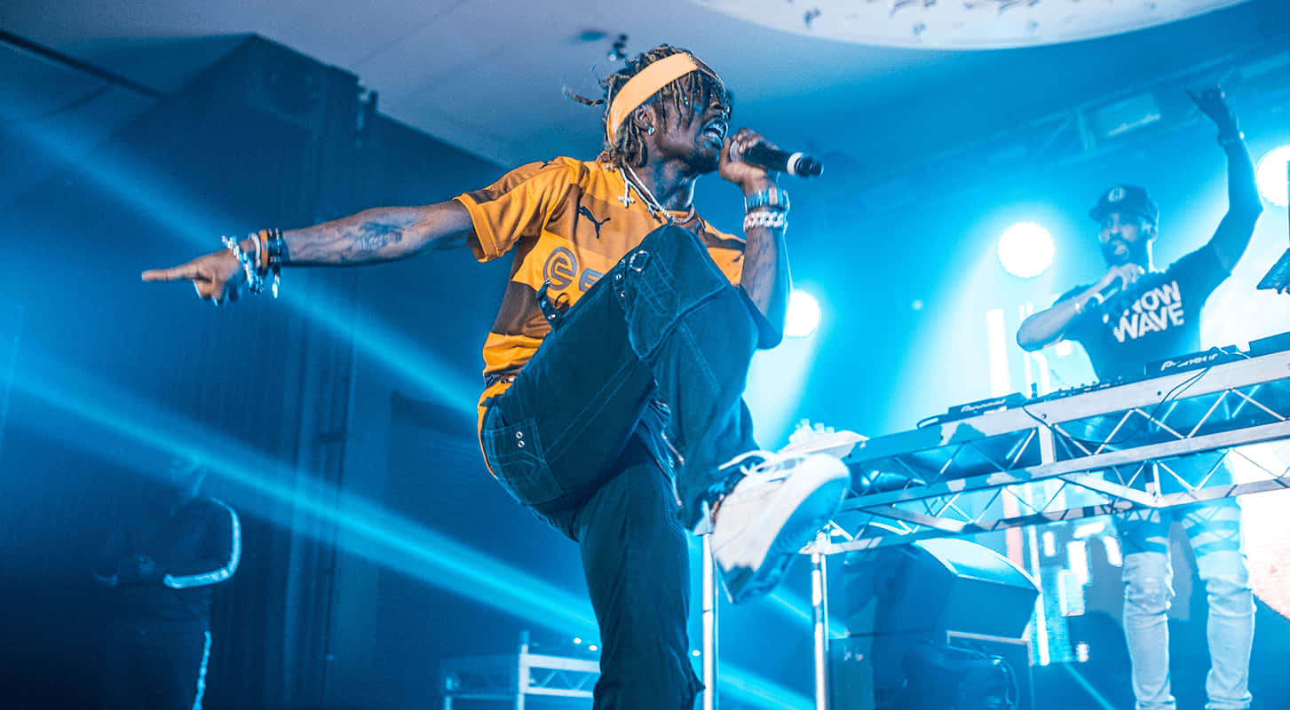 Lil Uzi Vert, blue stage, orange shirt, HD Desktop Wallpaper