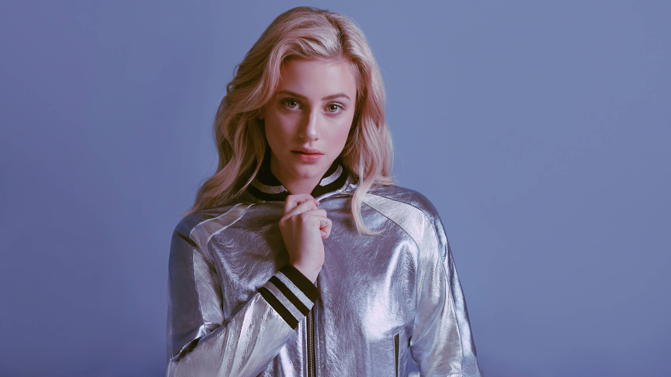 Lili Reinhart, shiny silver jacket, solid blue background, Full HD Desktop Wallpaper