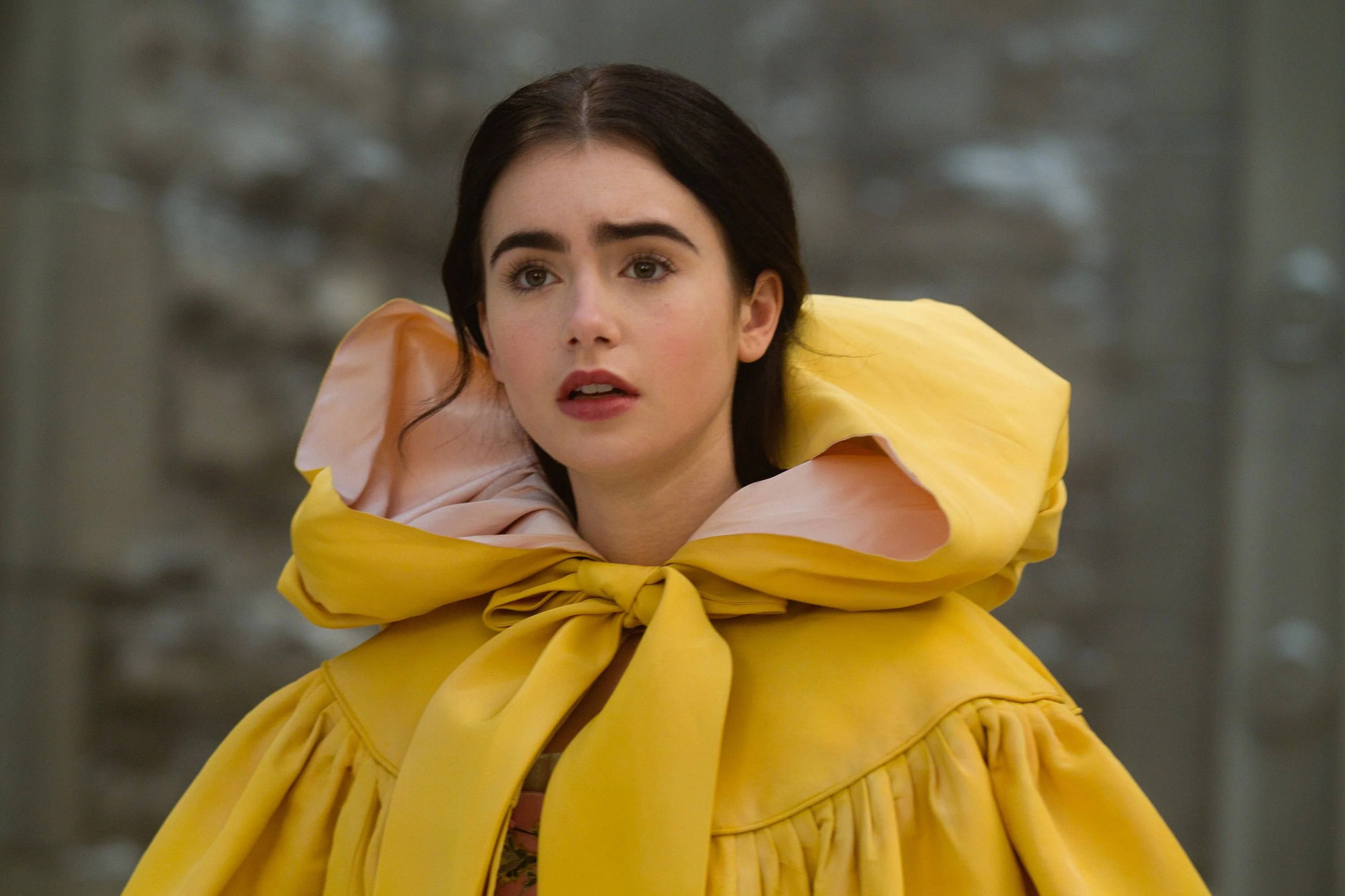 Lily Collins, Snow White, vibrant yellow hooded coat, 2K Desktop Wallpaper