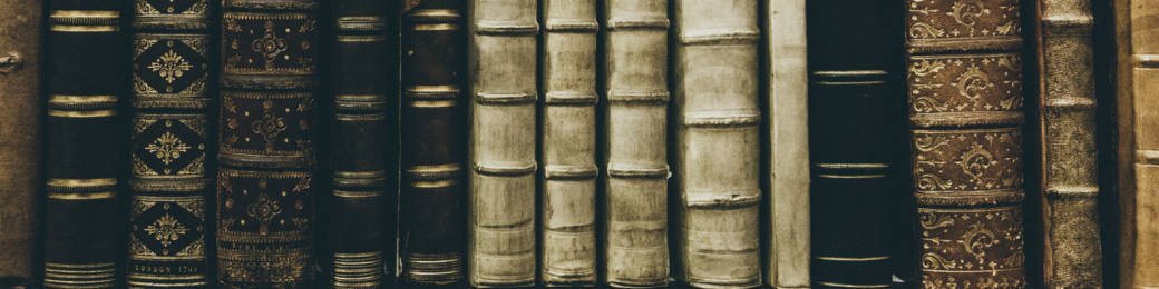 vintage leather-bound books, ornate gold detailing, warm sepia tones, SD Desktop Wallpaper
