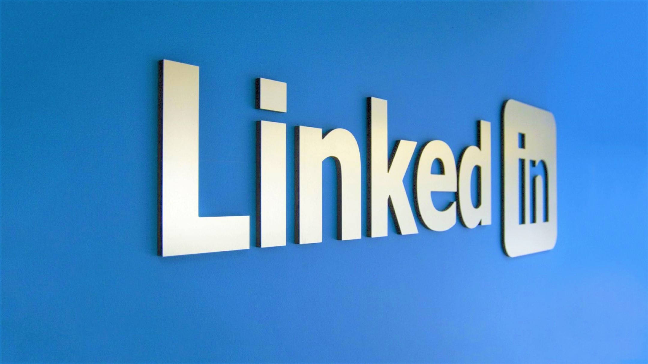 LinkedIn logo, metallic finish, vibrant blue wall, Full HD Desktop Wallpaper