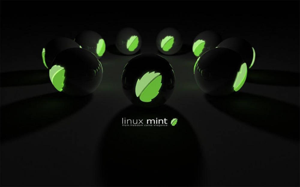 Linux Mint, glossy black spheres, glowing green leaf logos, SD Desktop Wallpaper