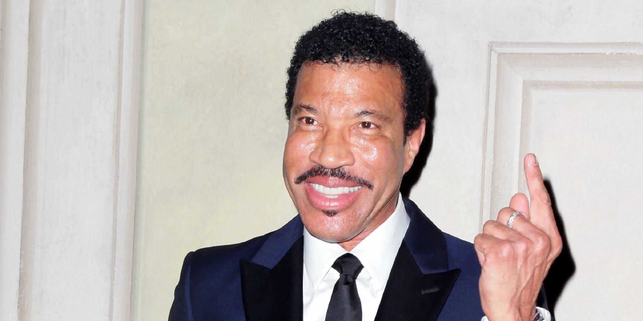 Lionel Richie, dark suit, light paneled wall, Full HD Desktop Wallpaper