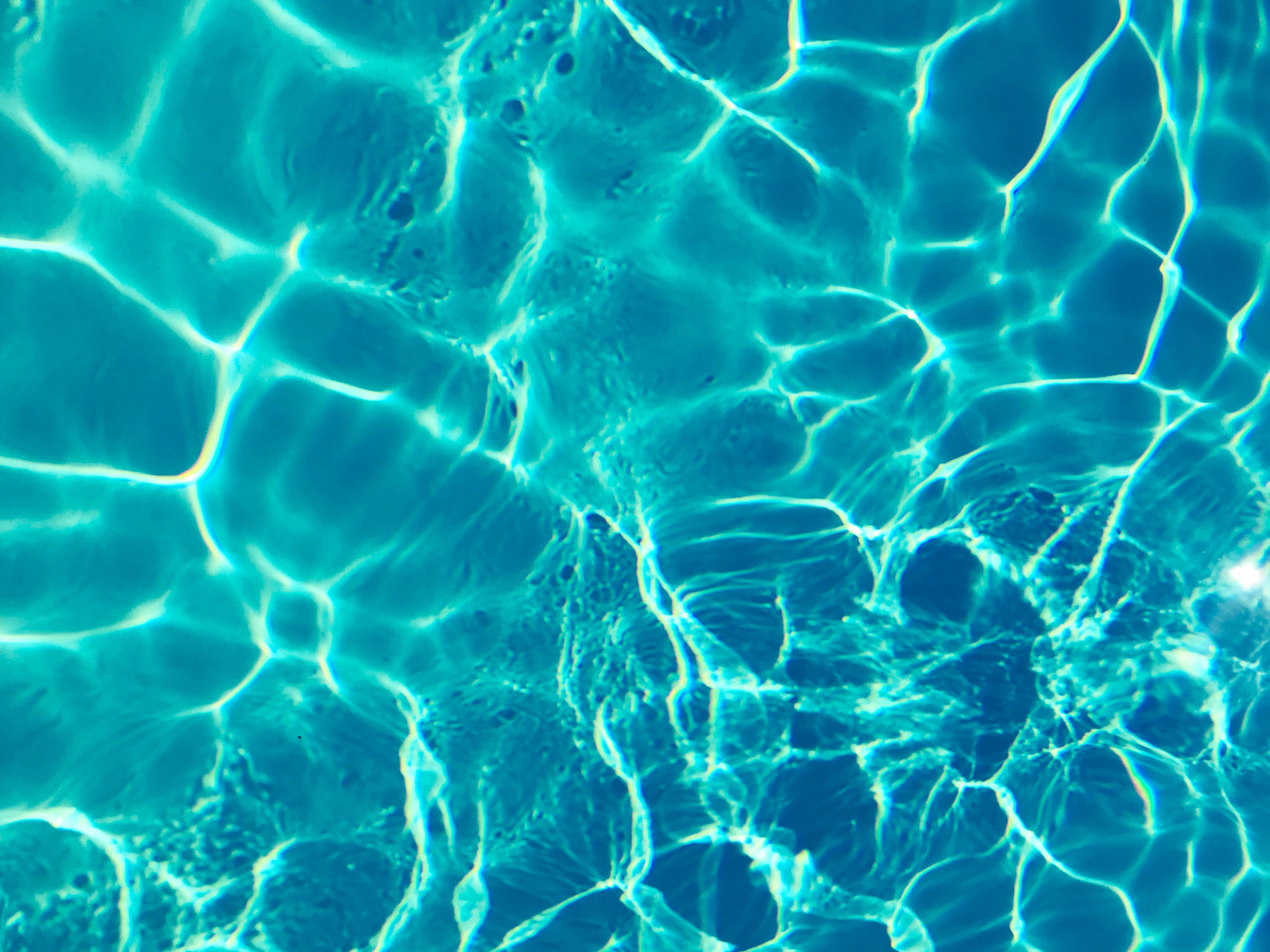 turquoise pool water, sunlight fractures, glowing geometric patterns, 4K Desktop Wallpaper