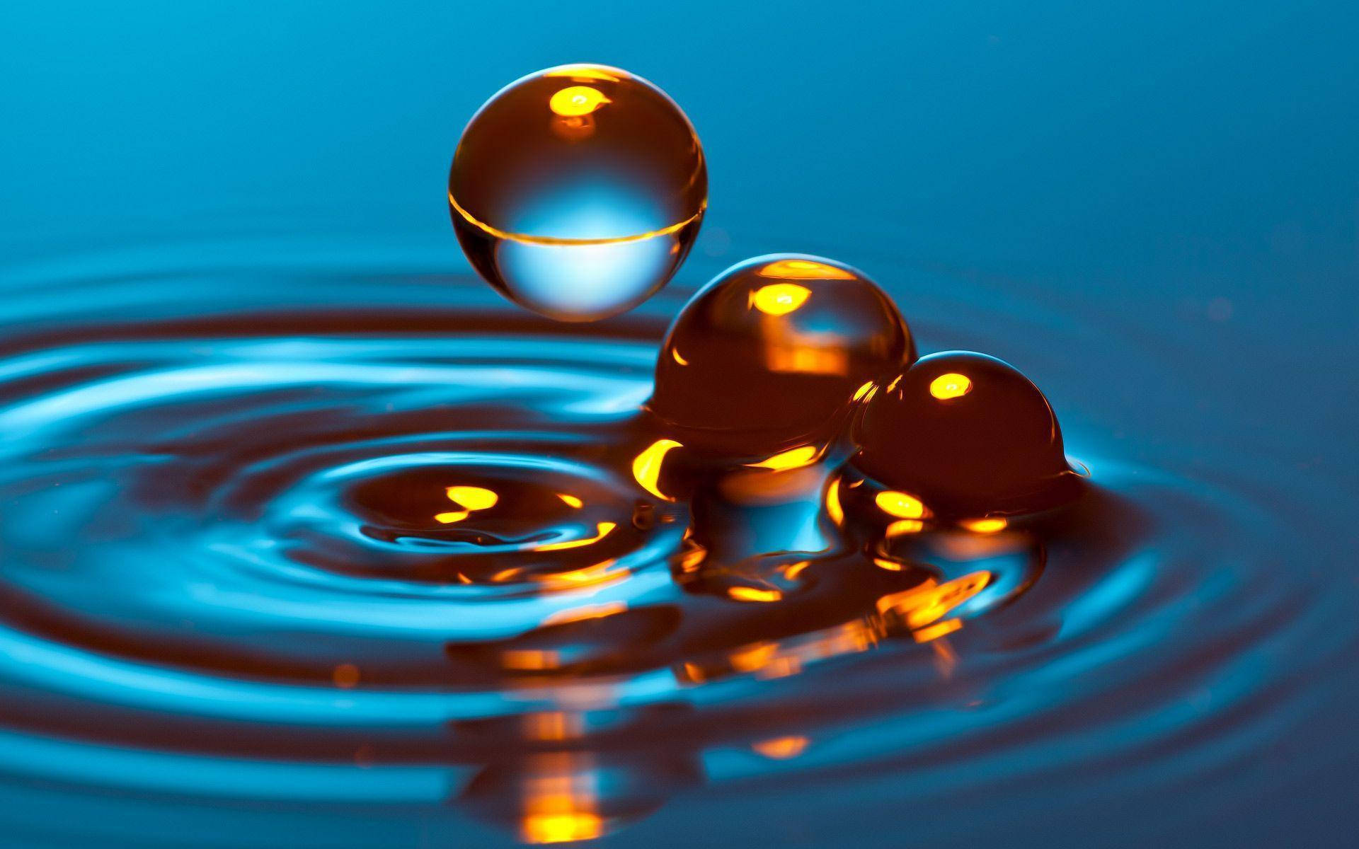 golden droplet, rippling blue water, radiant reflections, Full HD Desktop Wallpaper