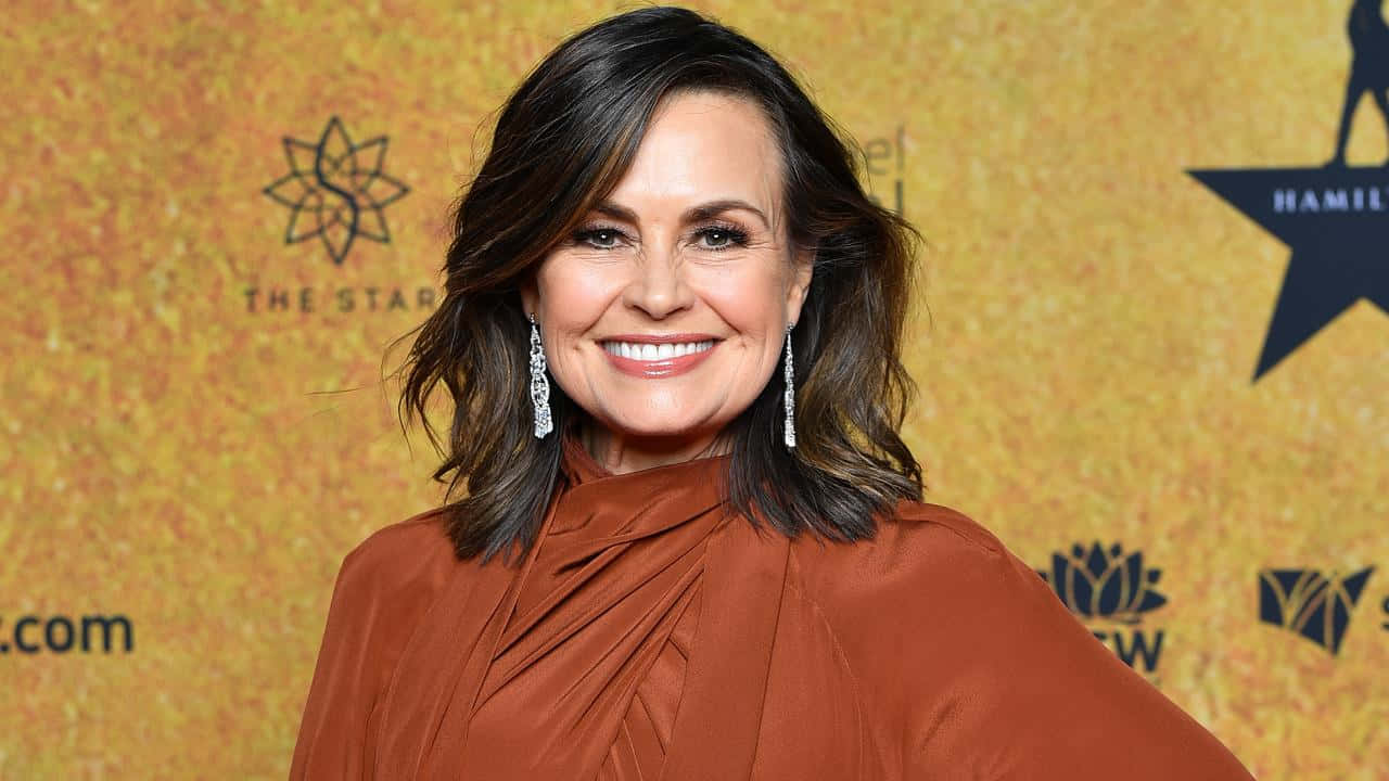 Lisa Wilkinson, rust-colored draped top, golden textured backdrop, HD Desktop Wallpaper
