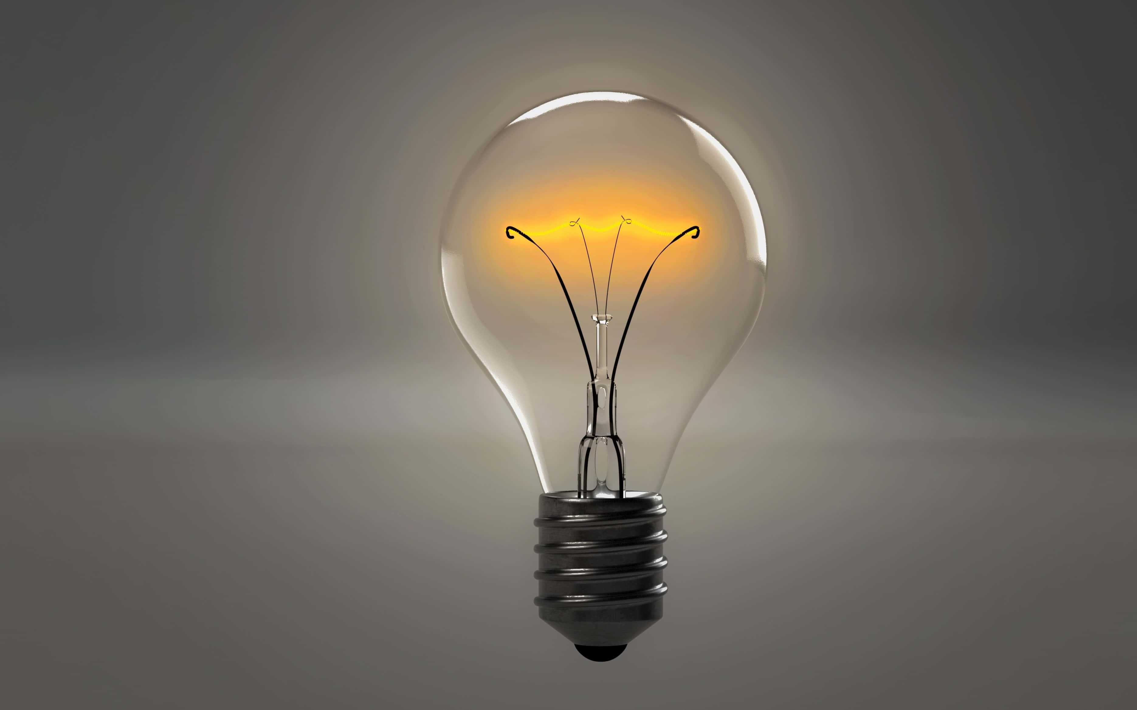 Lit iPhone, incandescent light bulb, filament, 2K Desktop Wallpaper