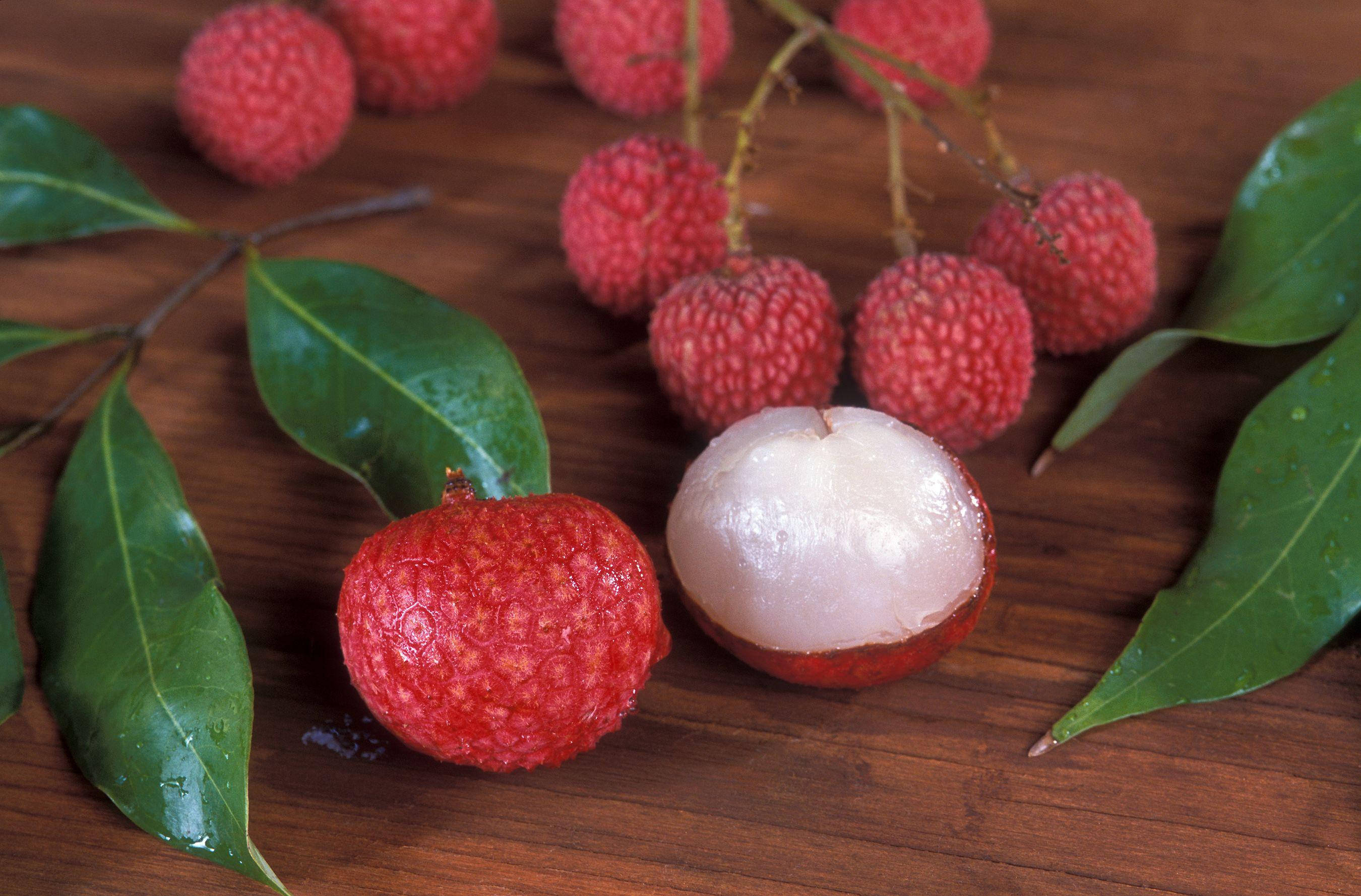 Litchi, red lychees, green leaves, 2K Desktop Wallpaper