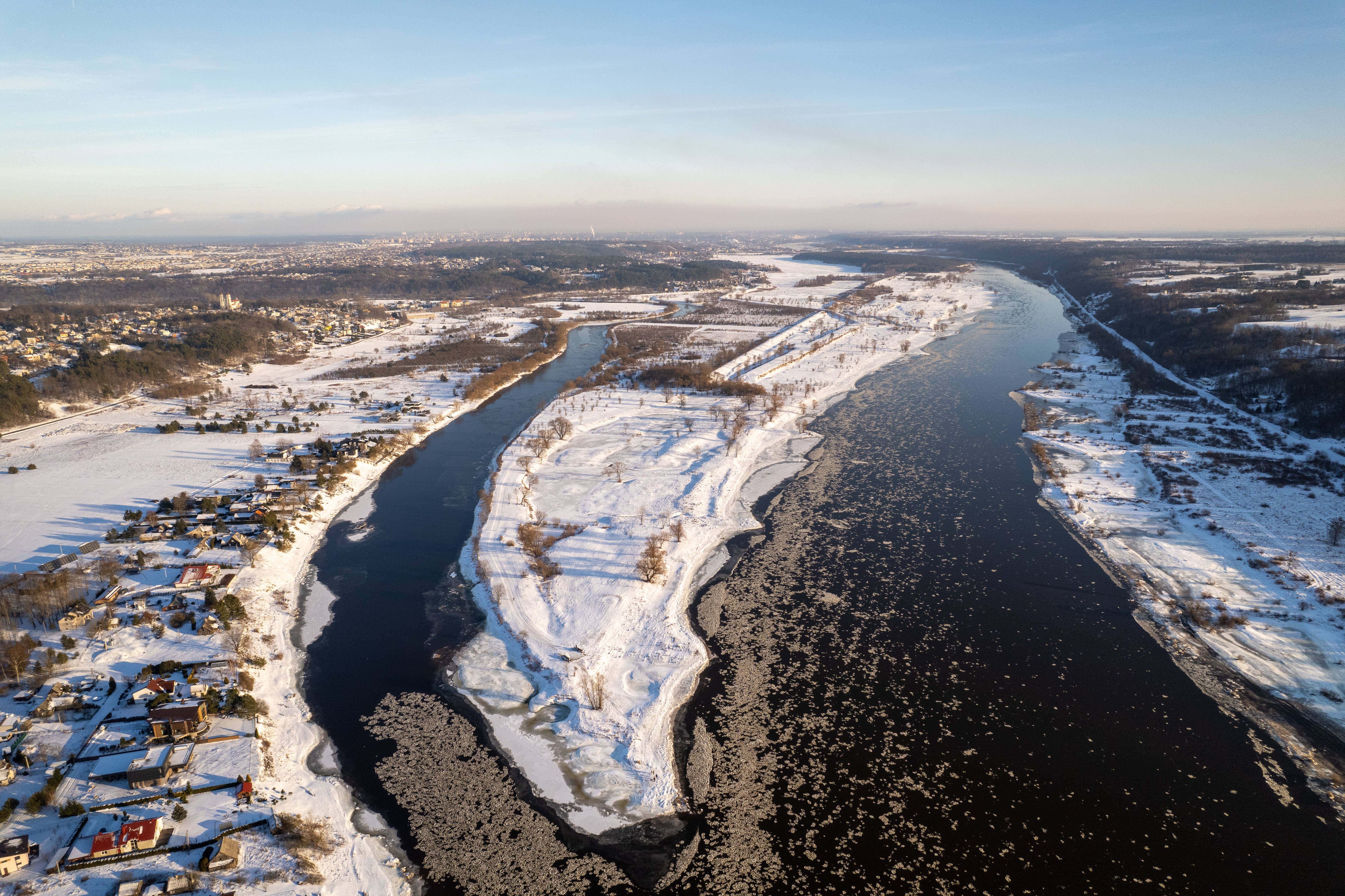 snowy town in Lithuania, winding river, snow-covered winter landscape, 5K Desktop Wallpaper