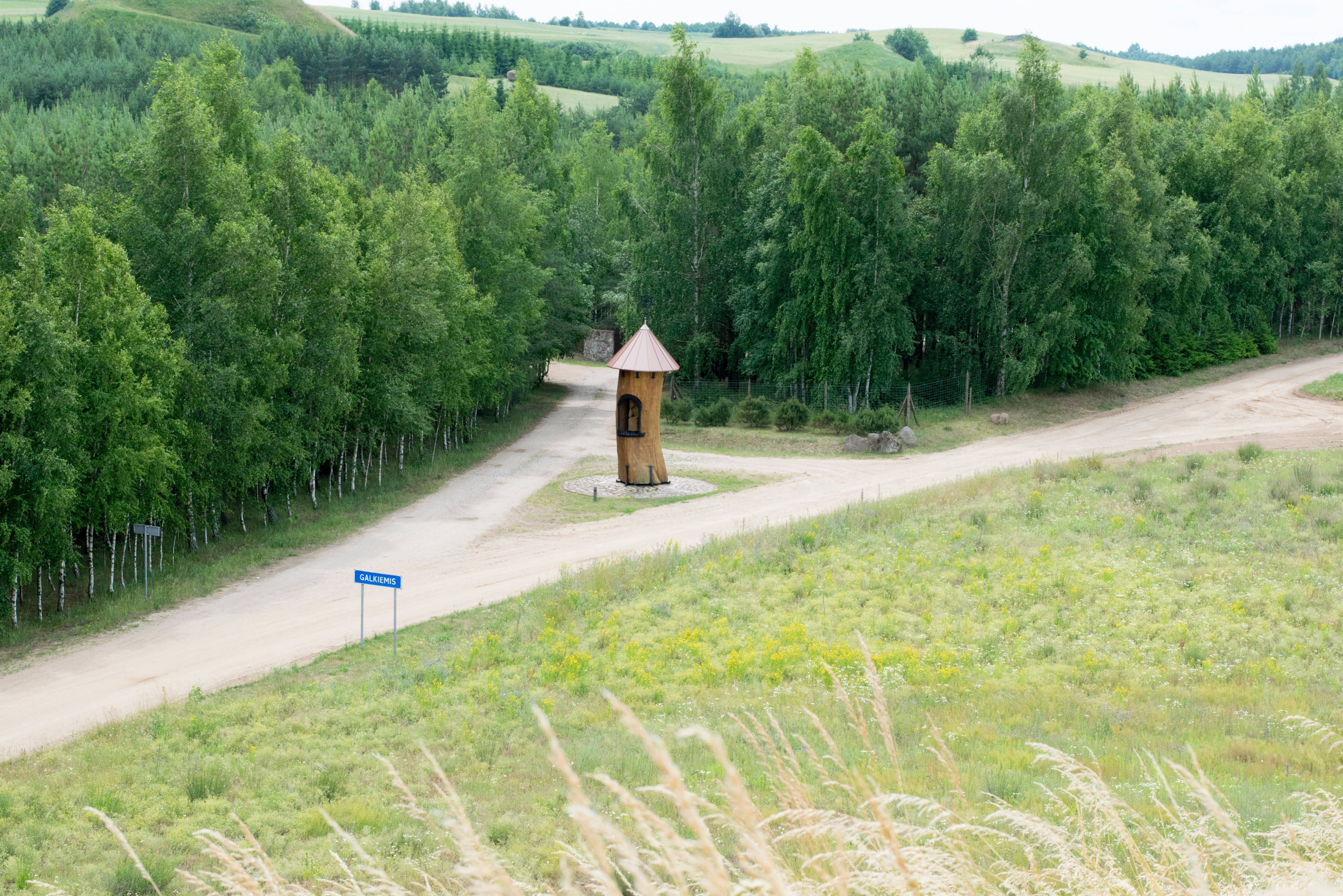 dirt road, wooden sentry tower, lush green forests, 5K Desktop Wallpaper