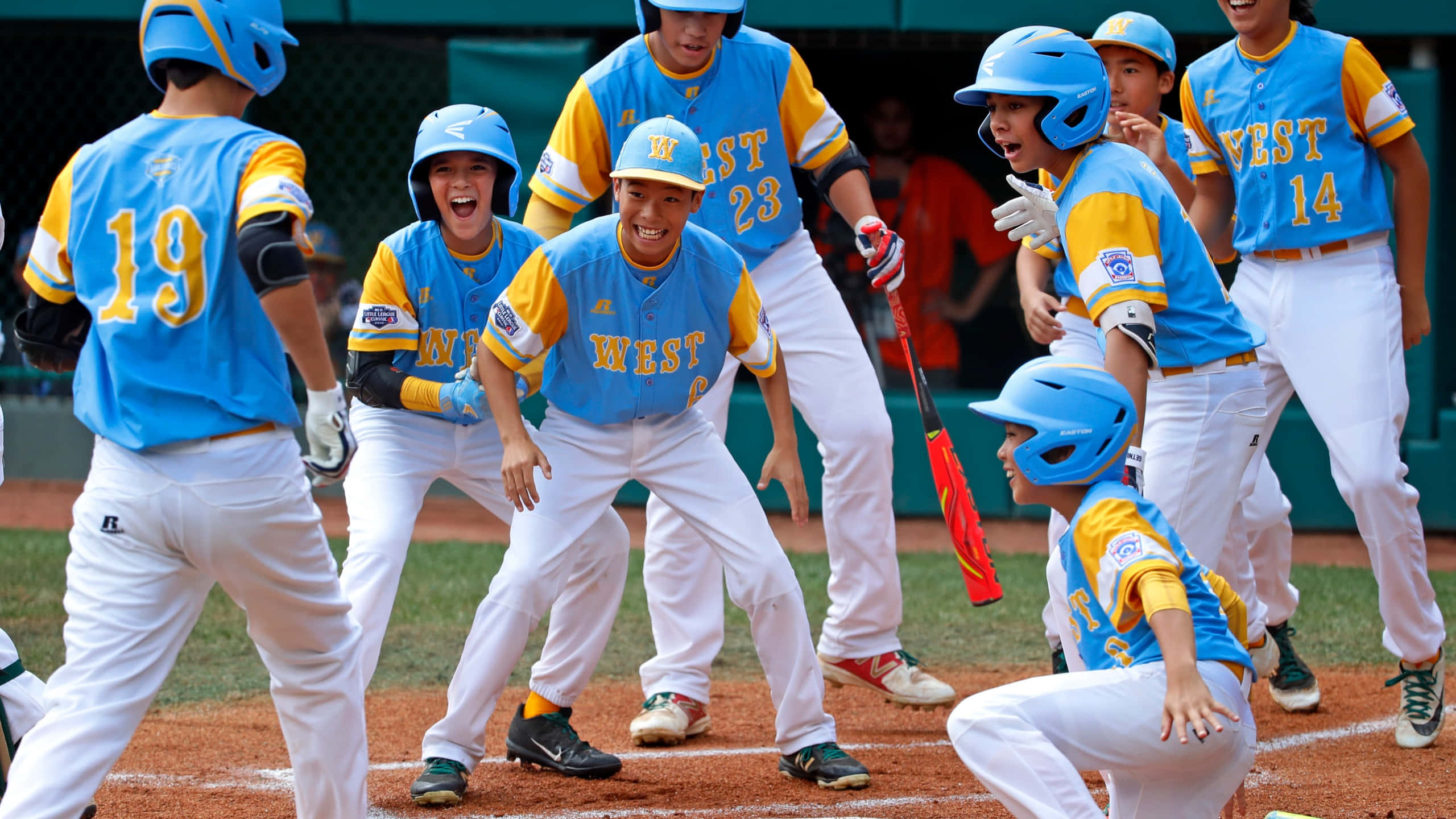 Little League Baseball, blue and yellow uniforms, sunlit field, 2K Desktop Wallpaper