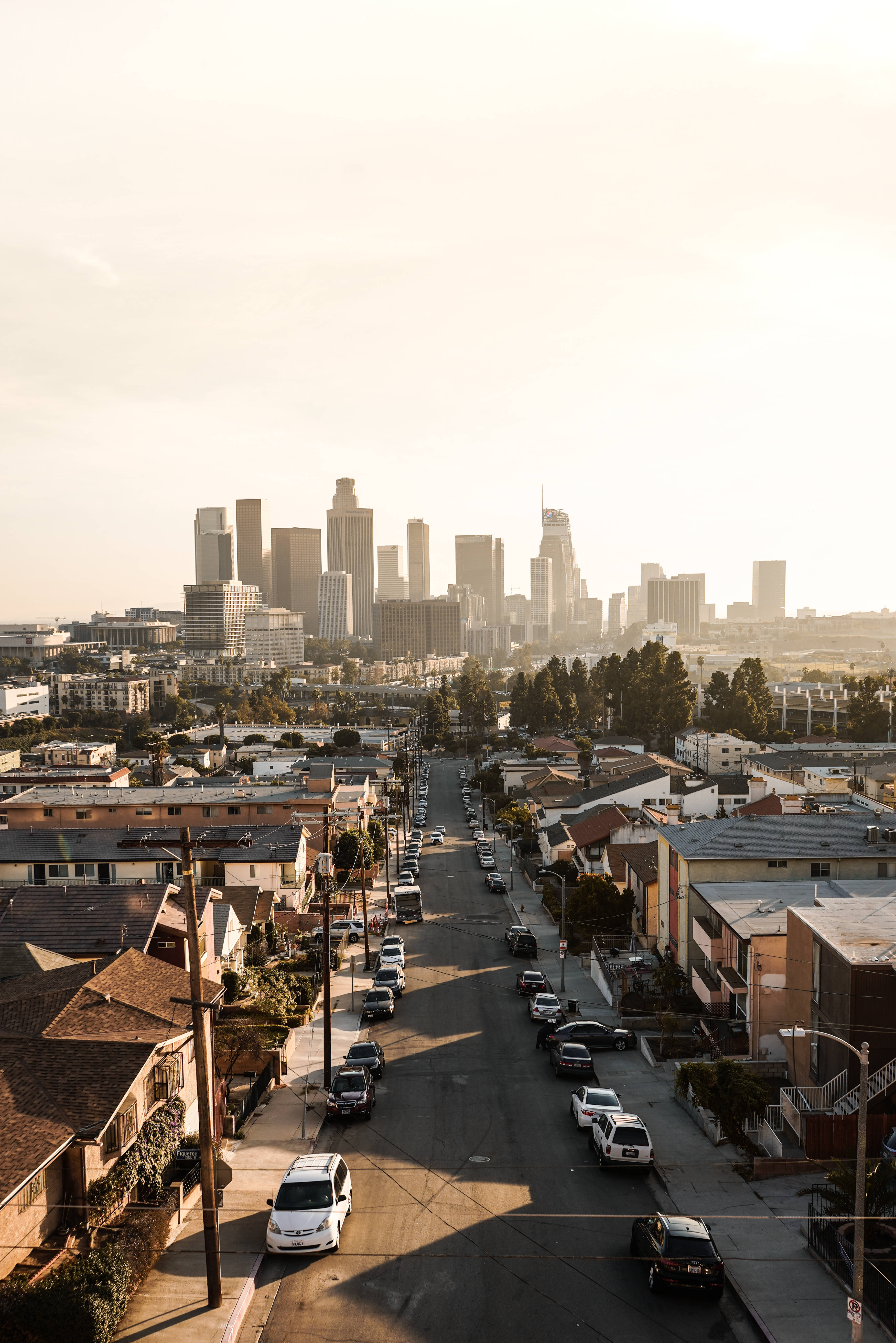 Lo Fi iPhone, sunlit urban street, city skyline, 5K Phone Wallpaper