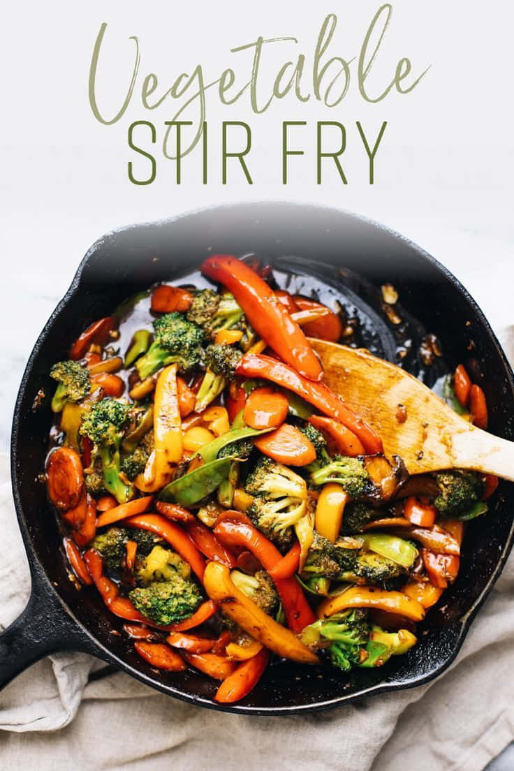 black cast iron skillet, wooden spoon, broccoli, SD Phone Wallpaper