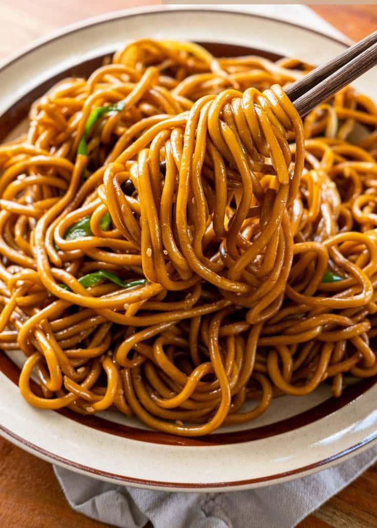 glossy brown noodles, green herbs, chopsticks, SD Phone Wallpaper