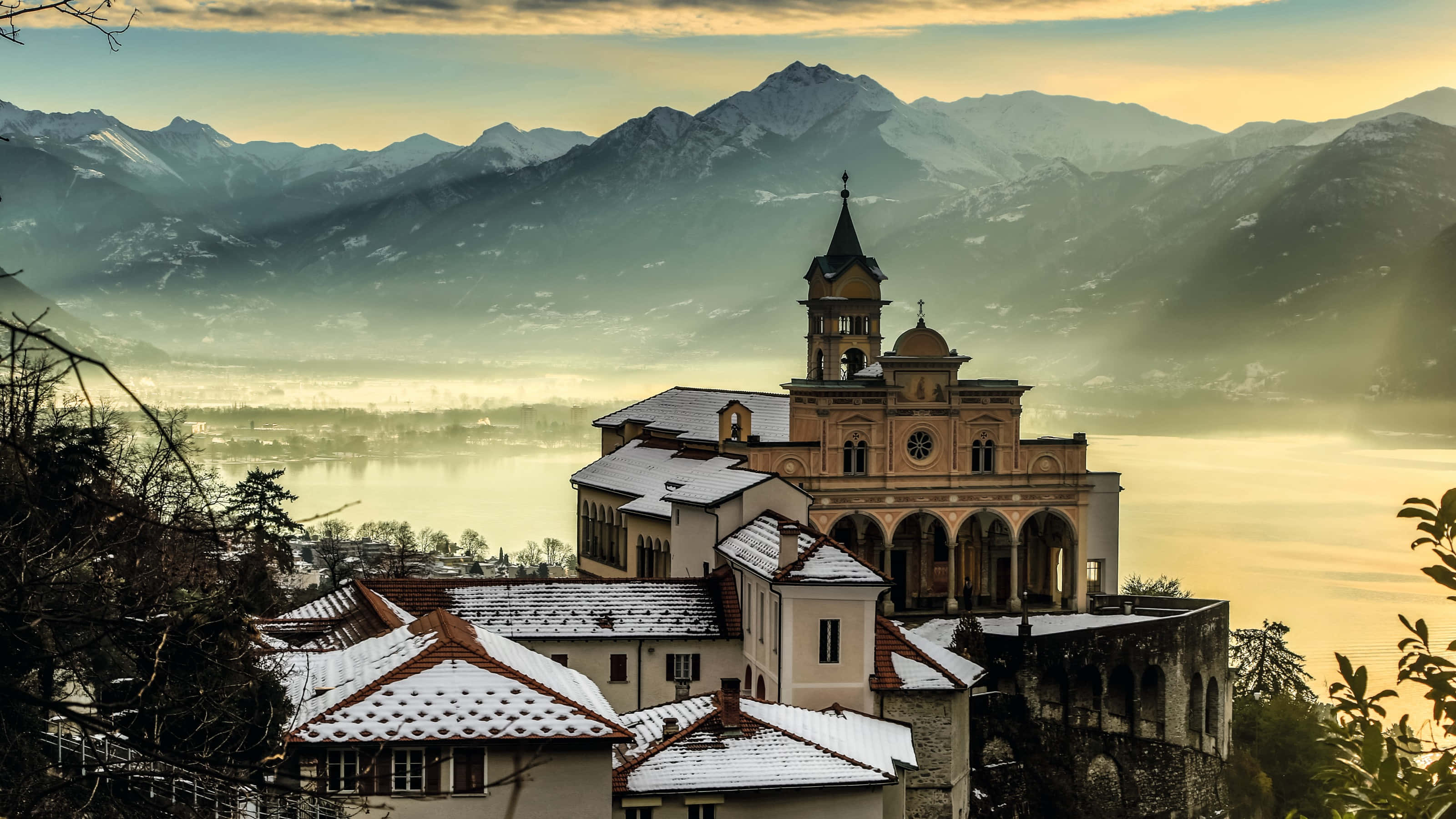 Locarno, snow-dusted church, misty lake, 2K Desktop Wallpaper