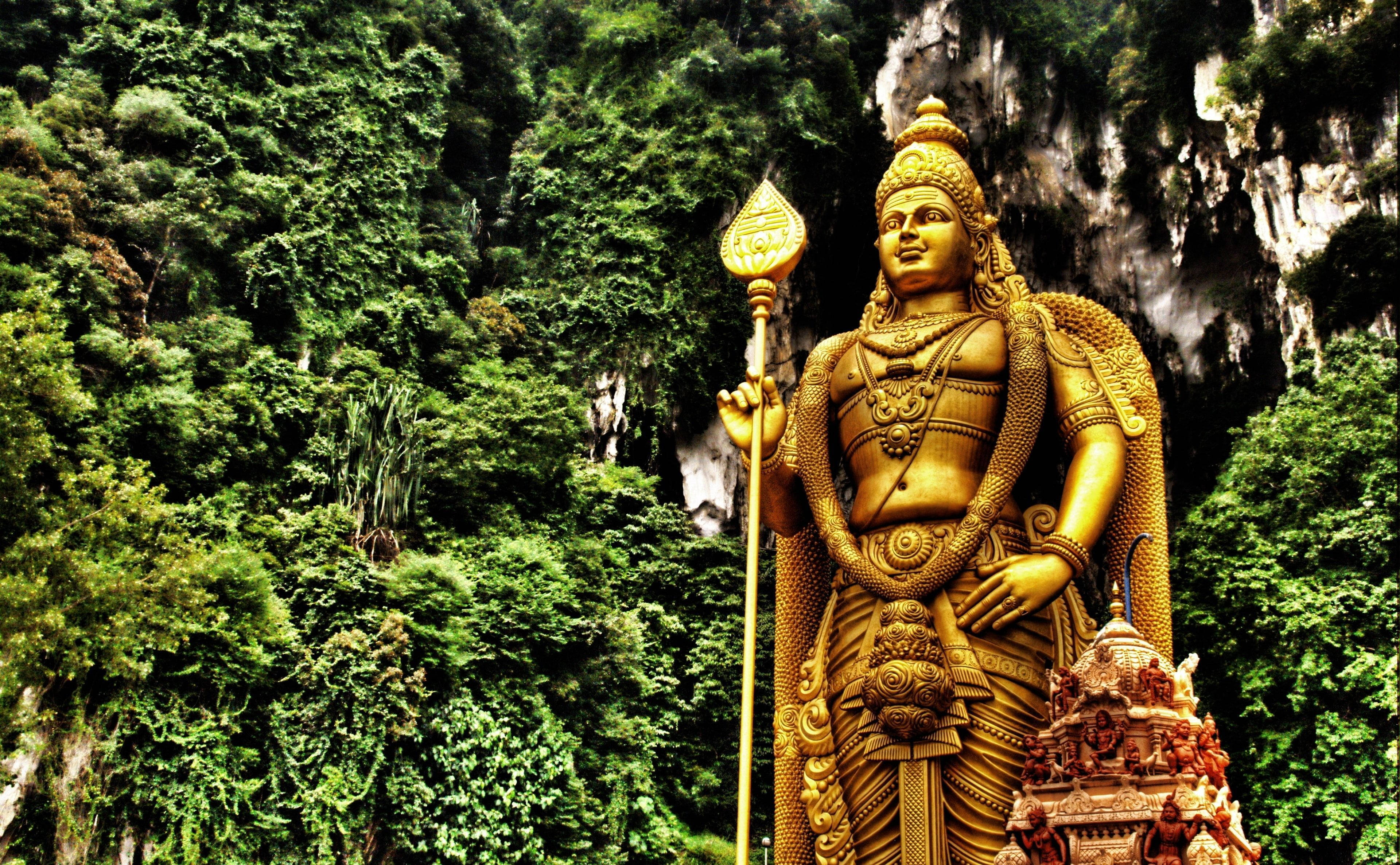 Lord Murugan, golden statue, lush green cliffside forest, 4K Desktop Wallpaper
