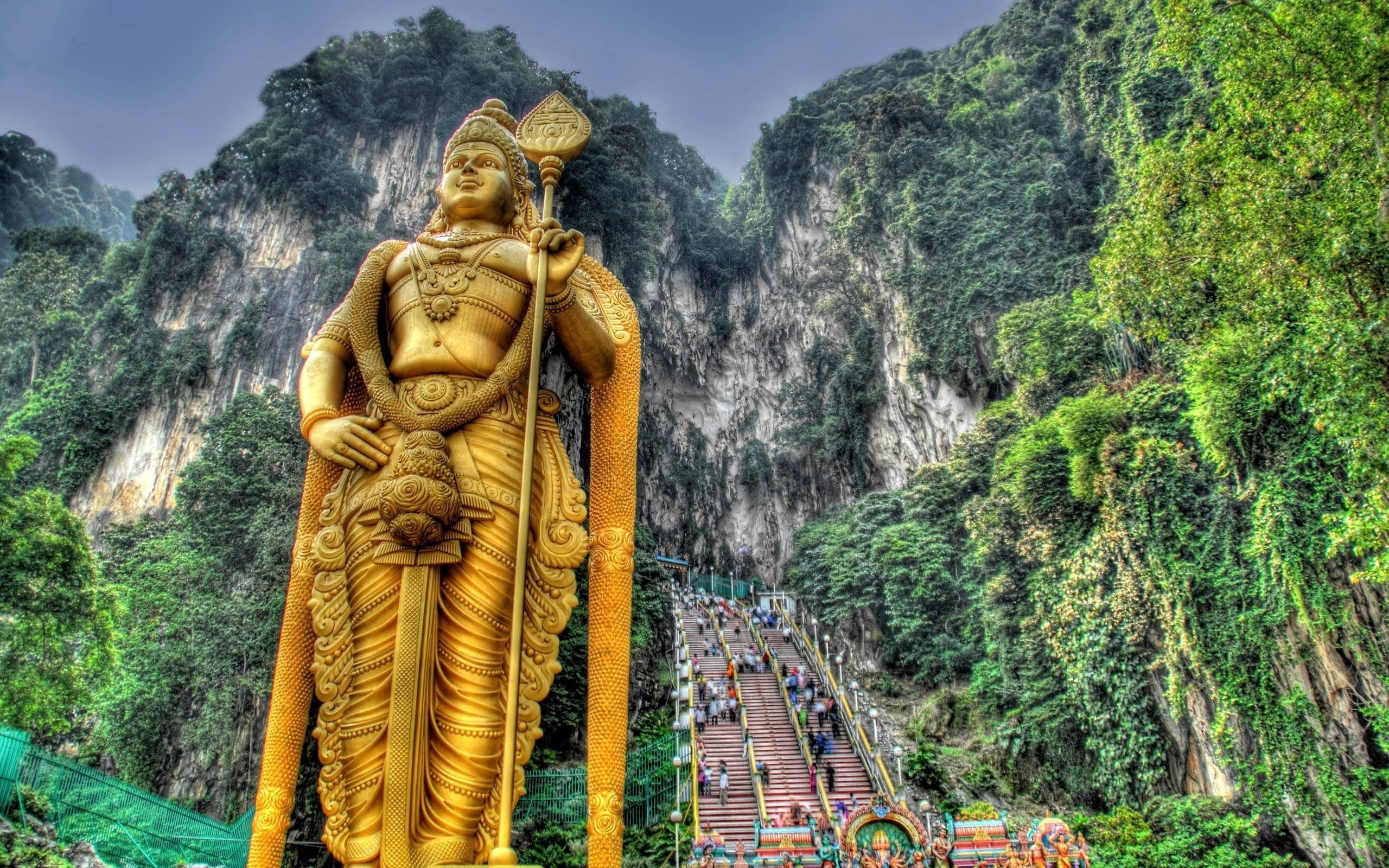 Lord Murugan, golden statue, lush green mountain, 2K Desktop Wallpaper