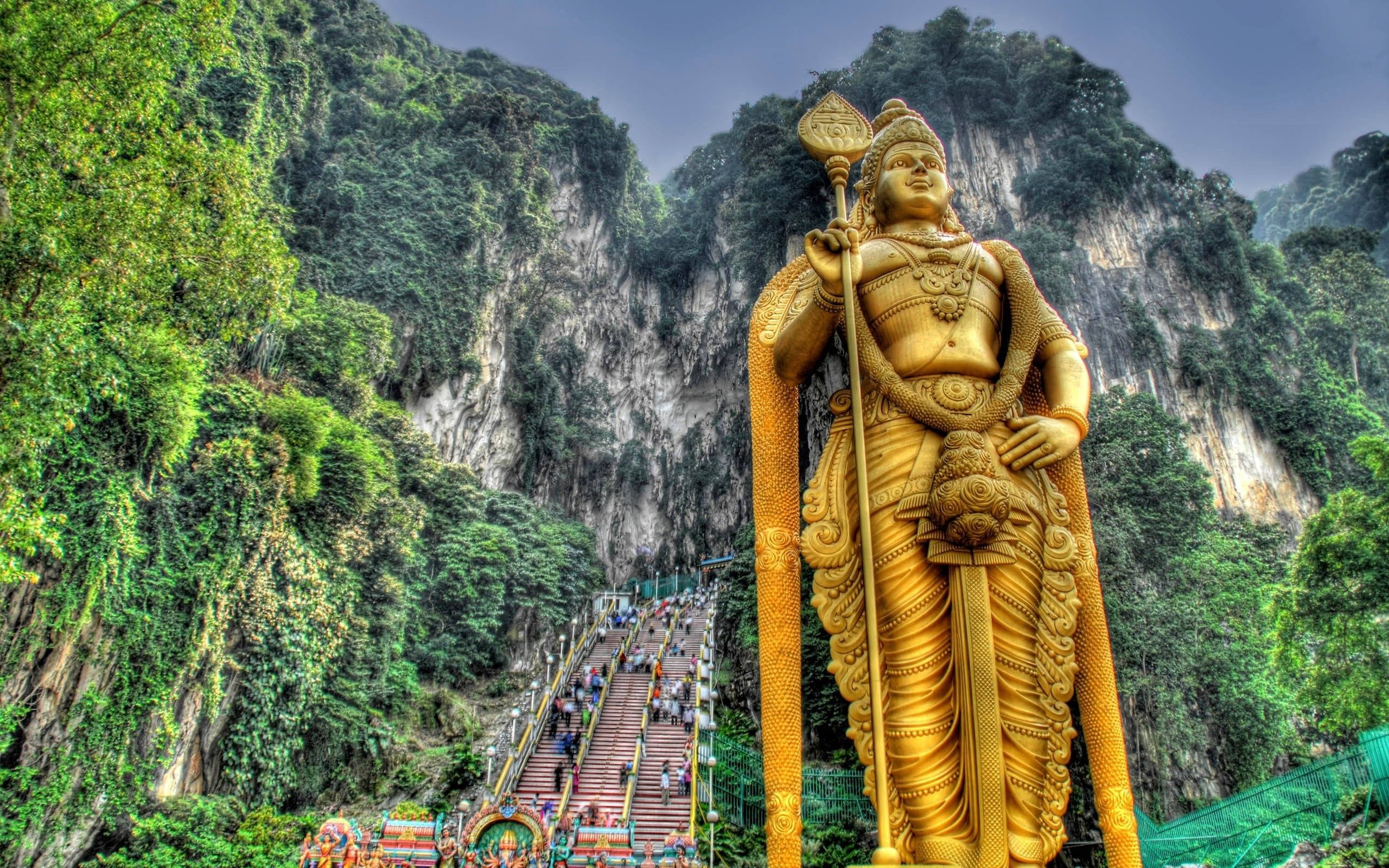 Lord Murugan, golden statue, lush green mountain, 2K Desktop Wallpaper