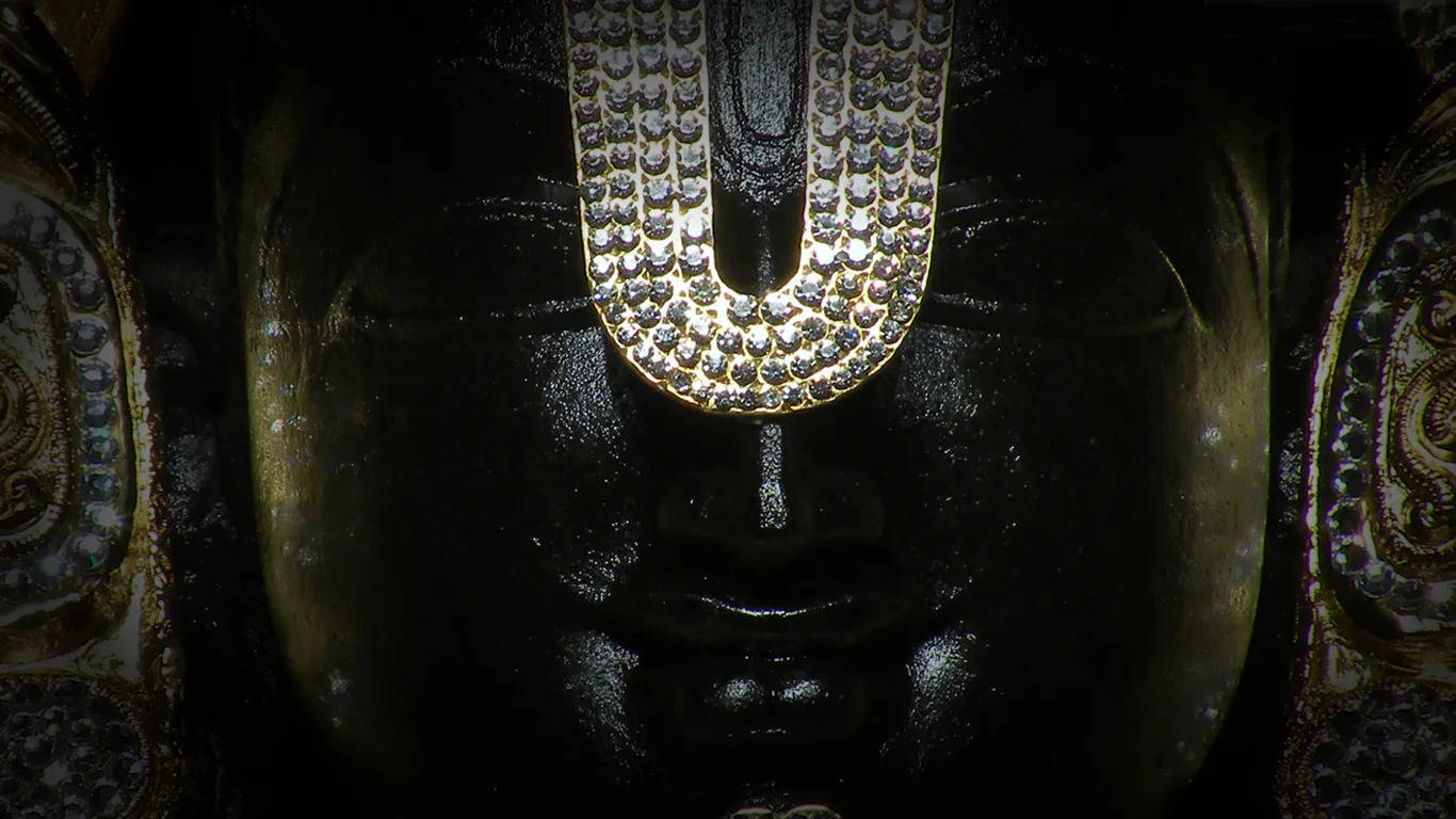 Black Lord Venkateswara, dark-skinned deity statue, glittering jeweled U-shaped ornament, HD Desktop Wallpaper