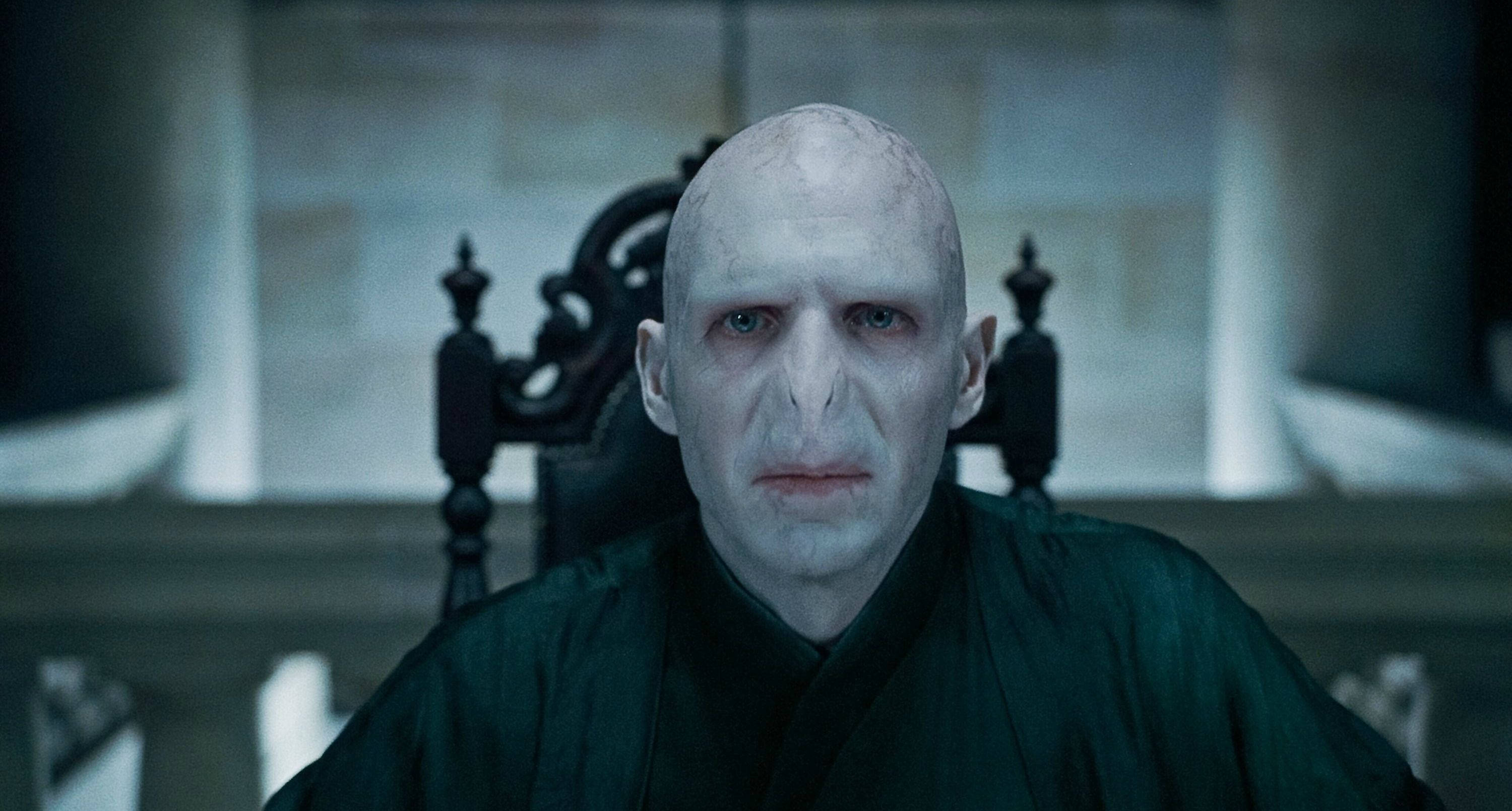 Lord Voldemort, dark ornate chair, dimly lit stone room, 2K Desktop Wallpaper