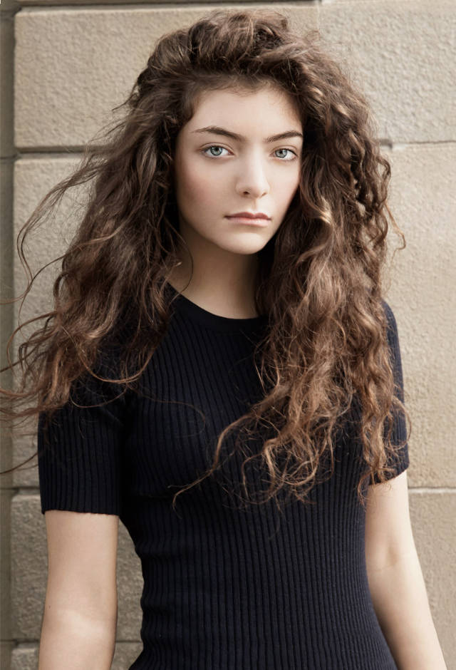 Lorde, voluminous curly brown hair, striking blue eyes, SD Phone Wallpaper