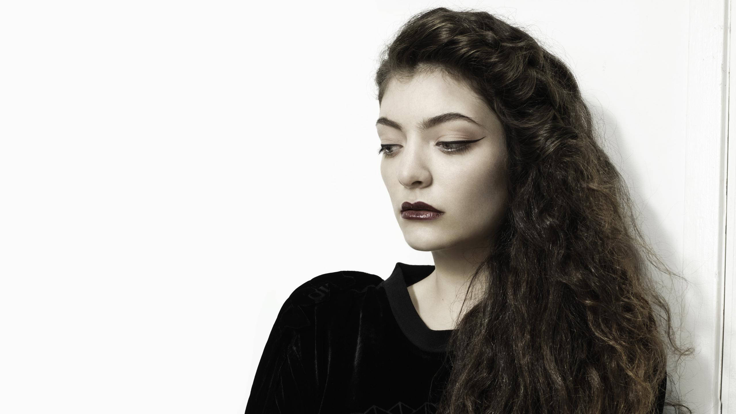 Lorde, black velvet top, white wall, 2K Desktop Wallpaper