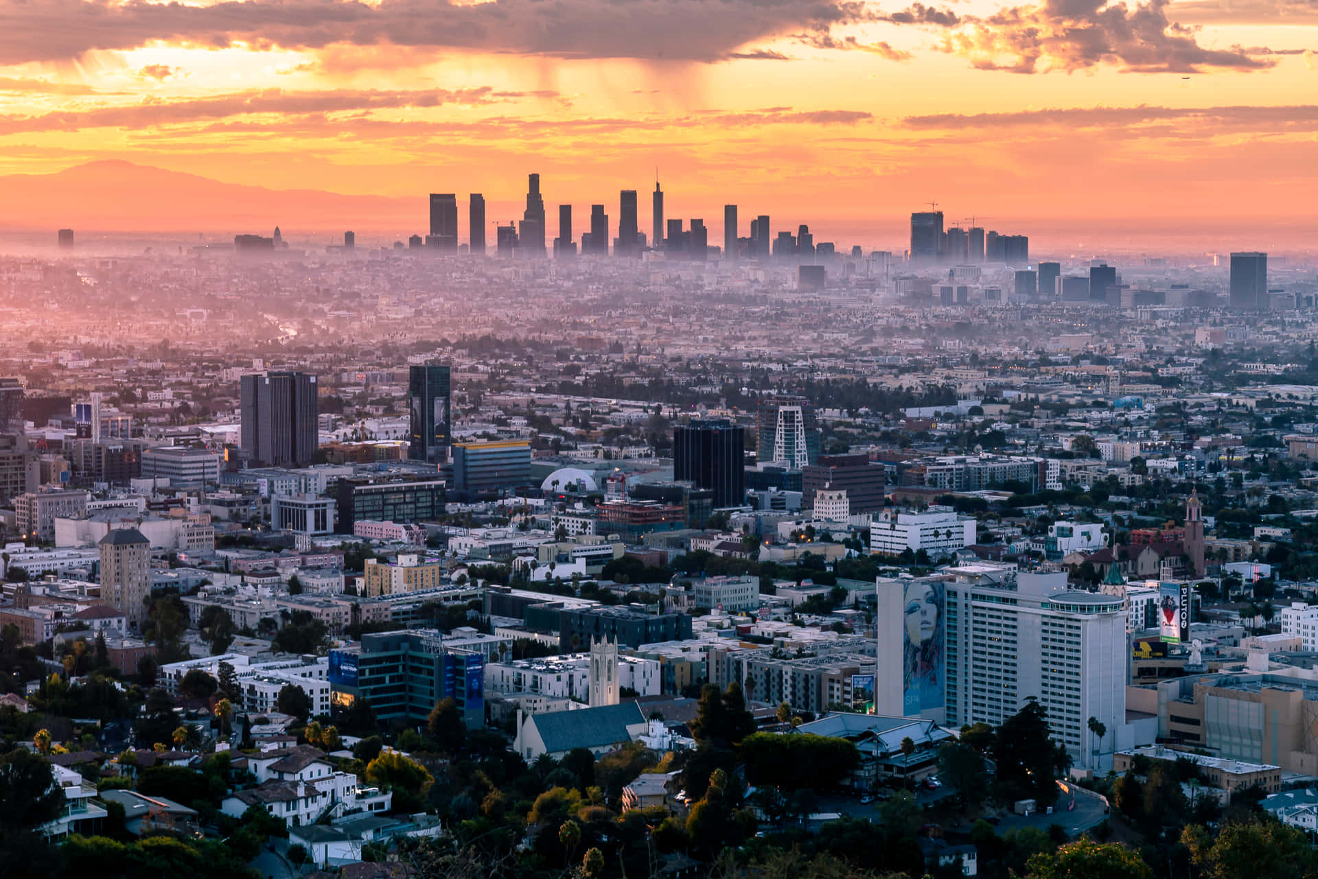 Los Angeles, foggy city skyline, warm sunset hues, Full HD Desktop Wallpaper