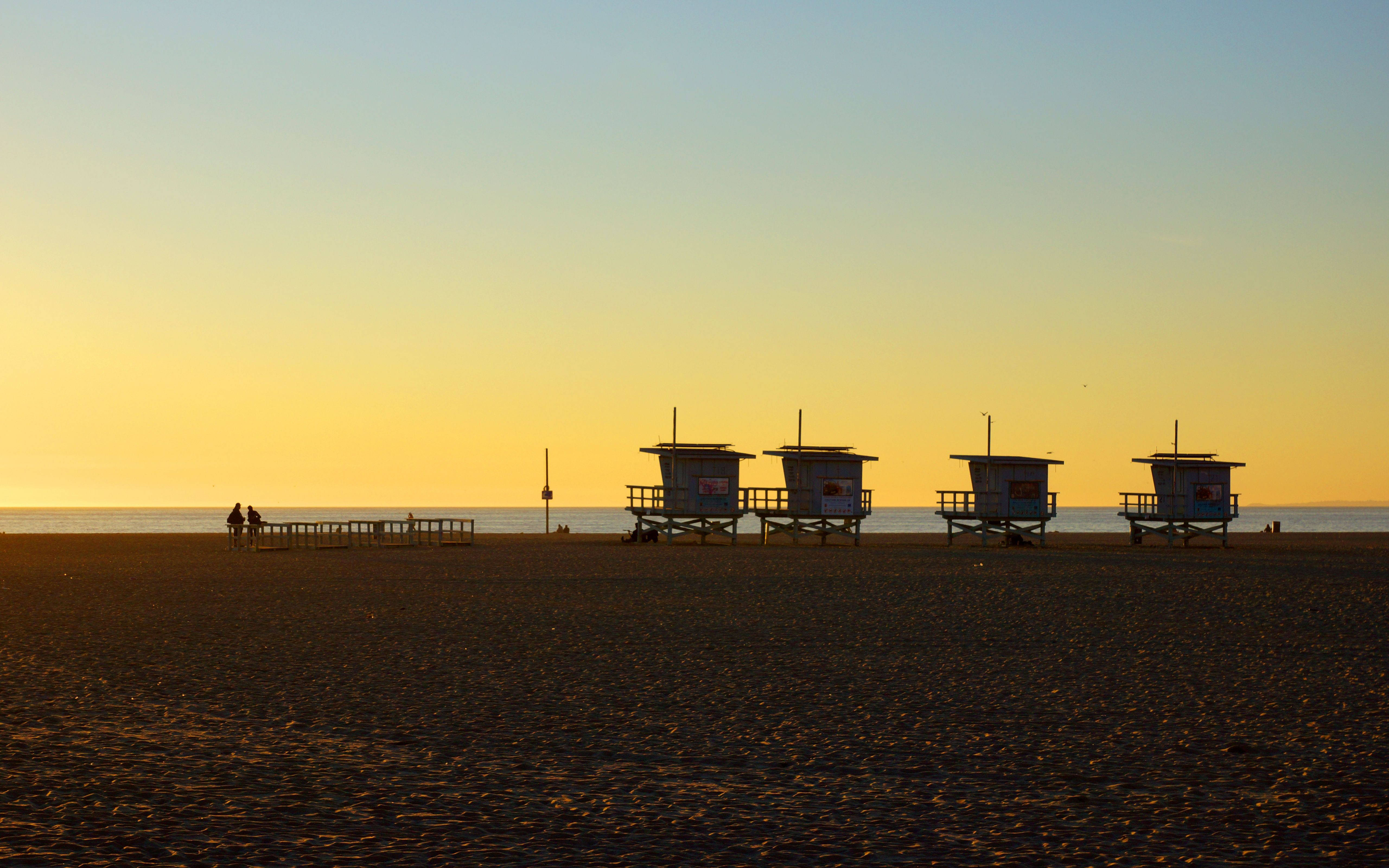 Los Angeles Sunset, lifeguard towers, sandy beach, 5K Desktop Wallpaper