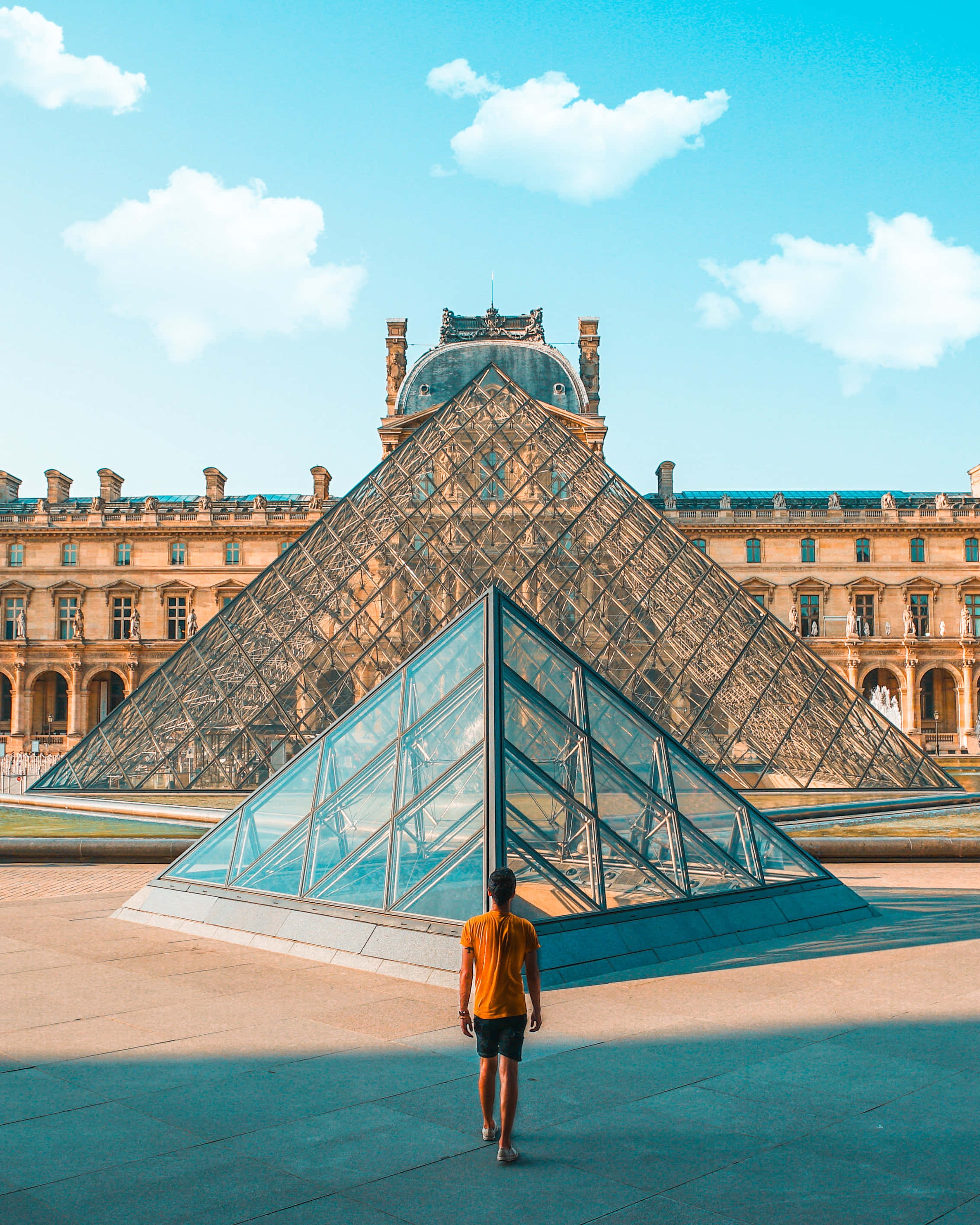 Louvre Museum, glass pyramid, orange shirt, 2K Phone Wallpaper