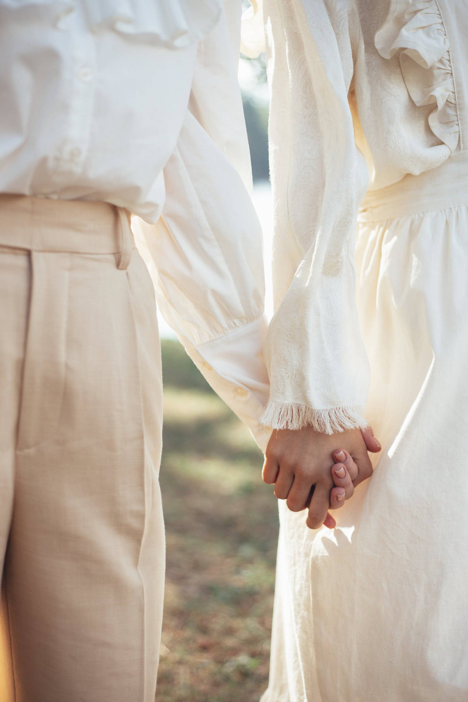 holding hands, cream clothing, soft natural light, Full HD Phone Wallpaper