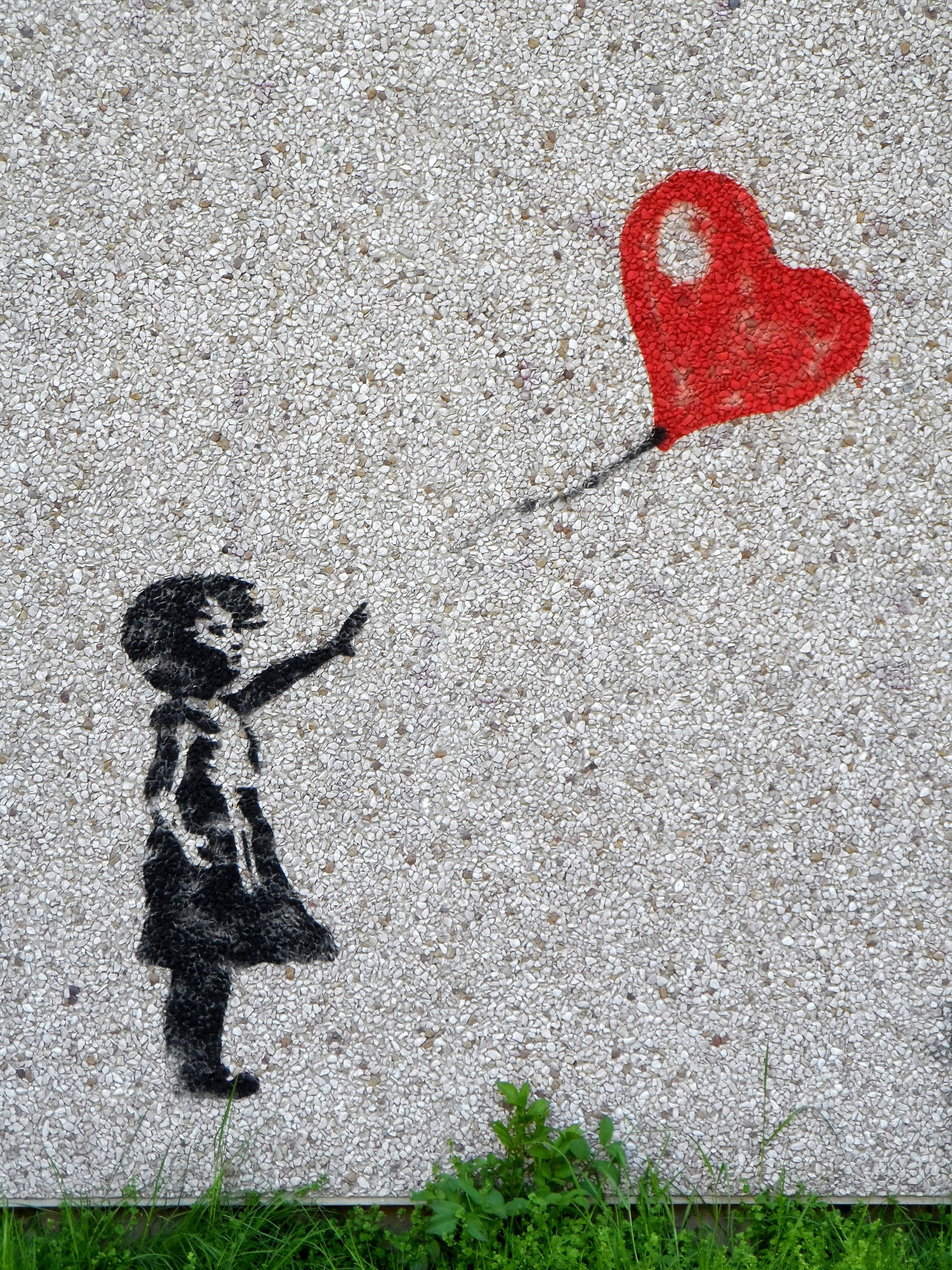 child, red heart-shaped balloon, speckled concrete wall, 4K Phone Wallpaper