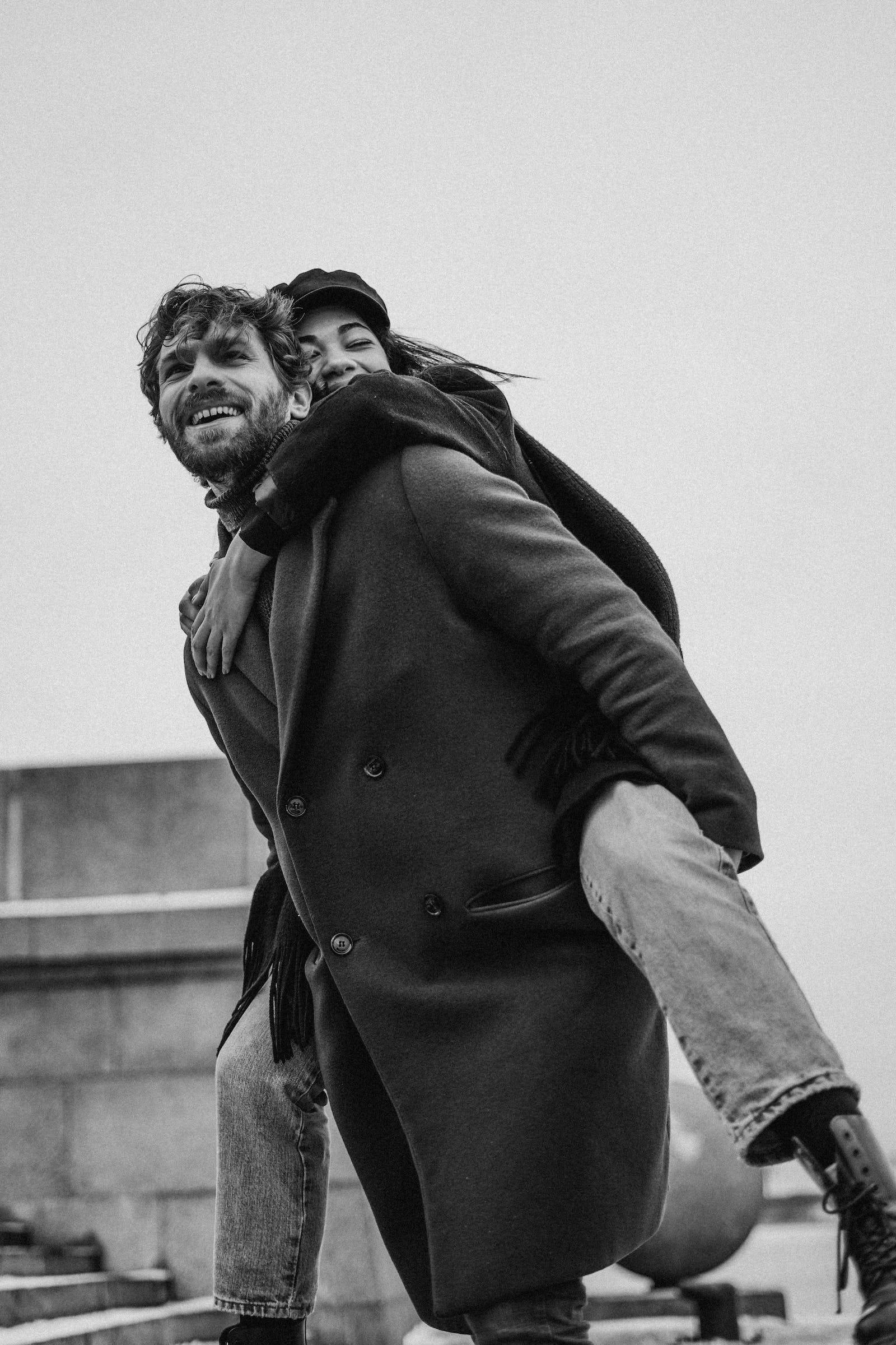 piggyback ride, joyful couple, urban rooftop backdrop, Full HD Phone Wallpaper