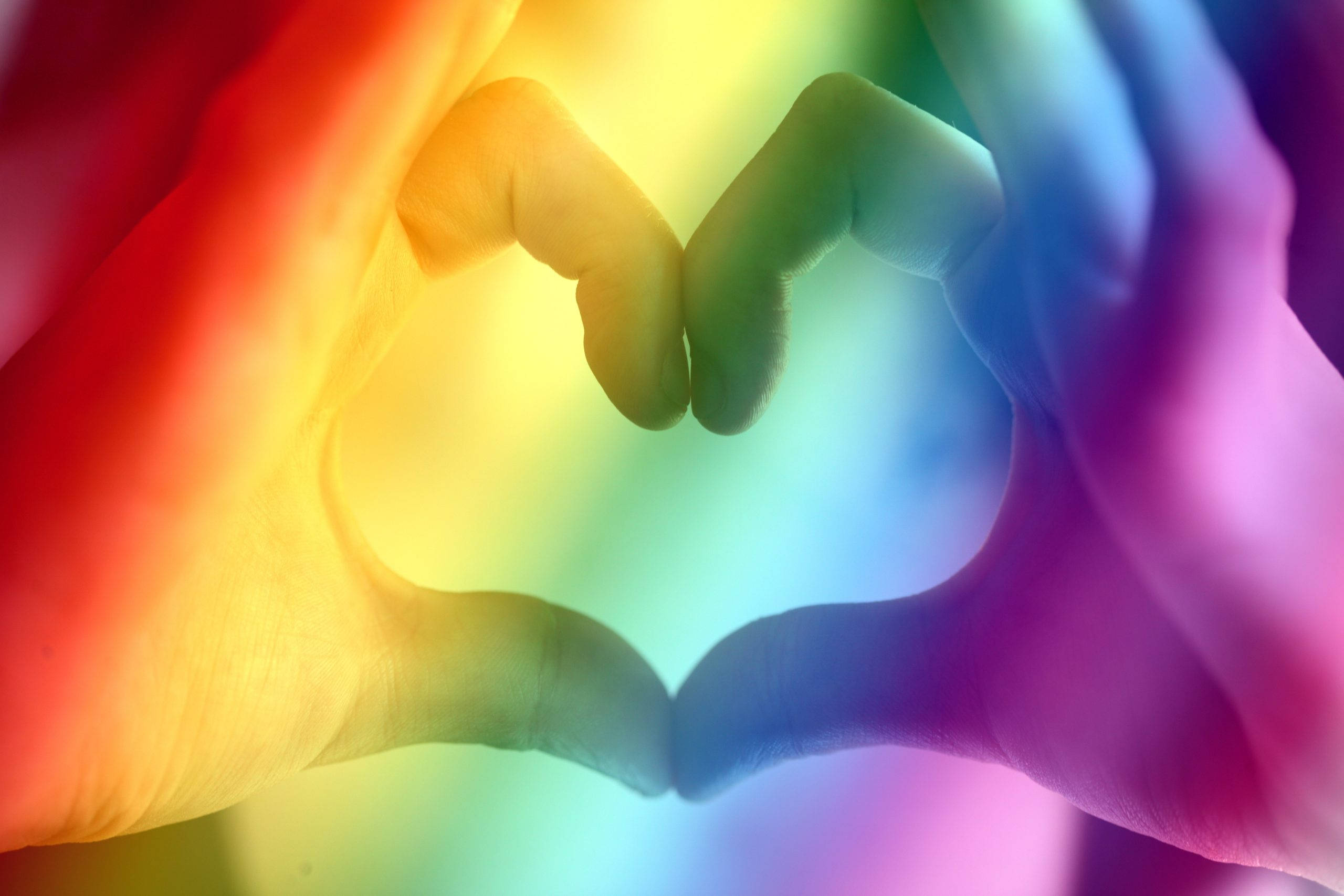 Love Is Love, heart hand sign, vibrant rainbow gradient background, 2K Desktop Wallpaper