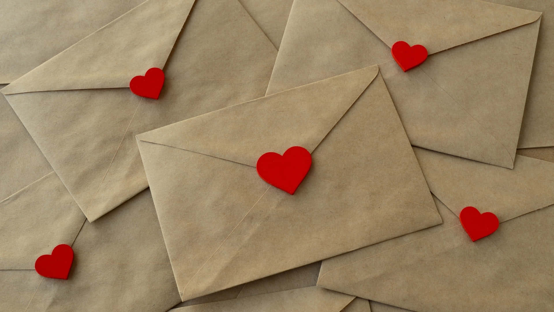 brown paper envelopes, bright red paper heart, scattered pile, Full HD Desktop Wallpaper