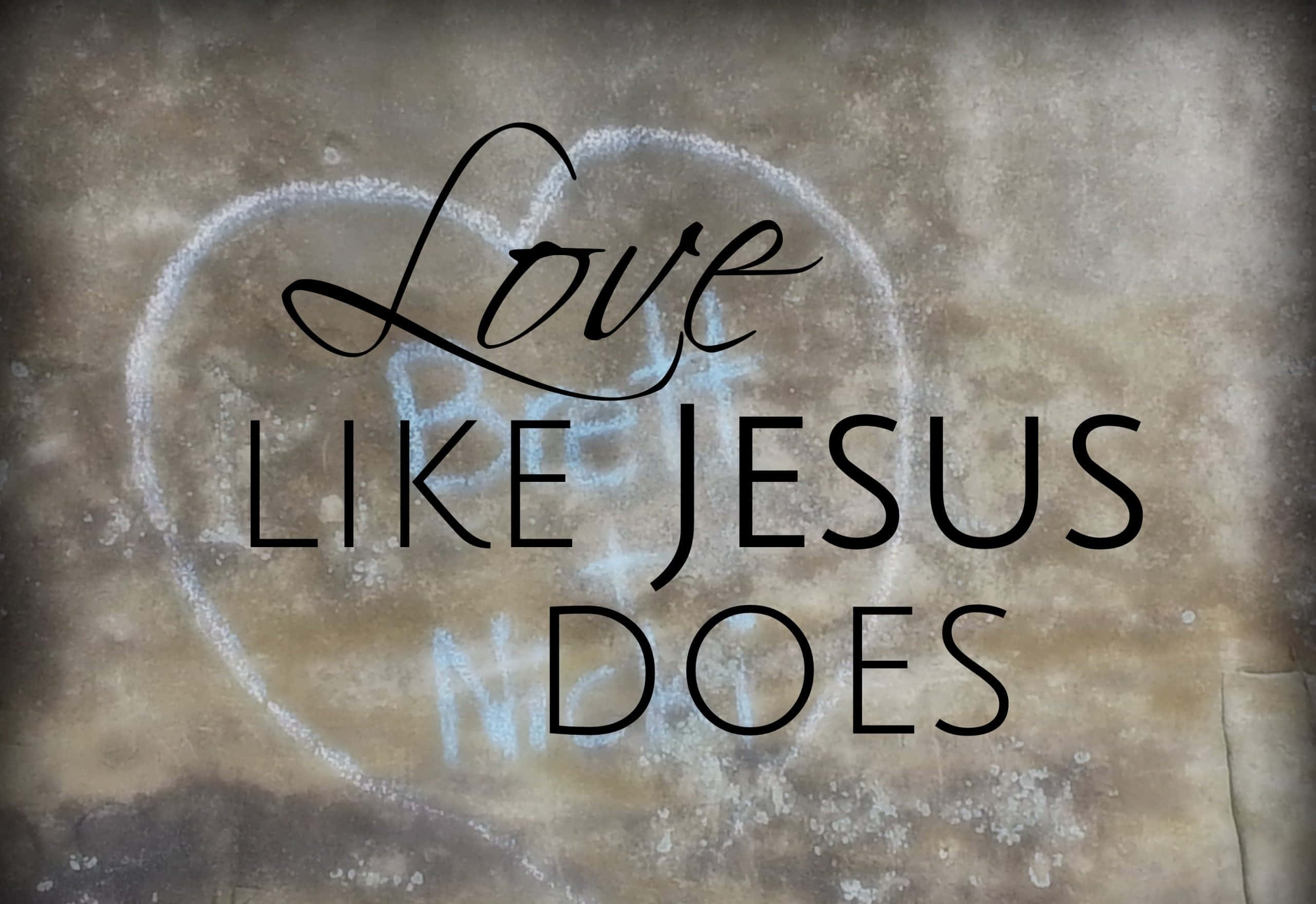 Love Like Jesus, chalk-drawn heart, rough concrete wall, 2K Desktop Wallpaper