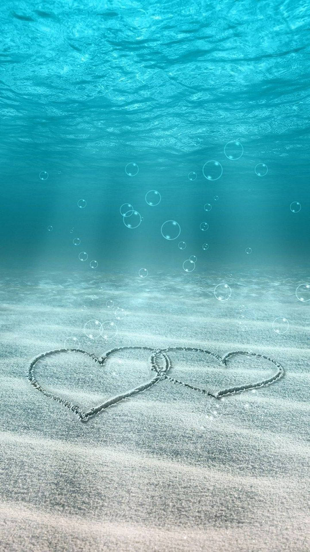 hearts underwater love phone, interlocked hearts, sand underwater, Full HD Phone Wallpaper