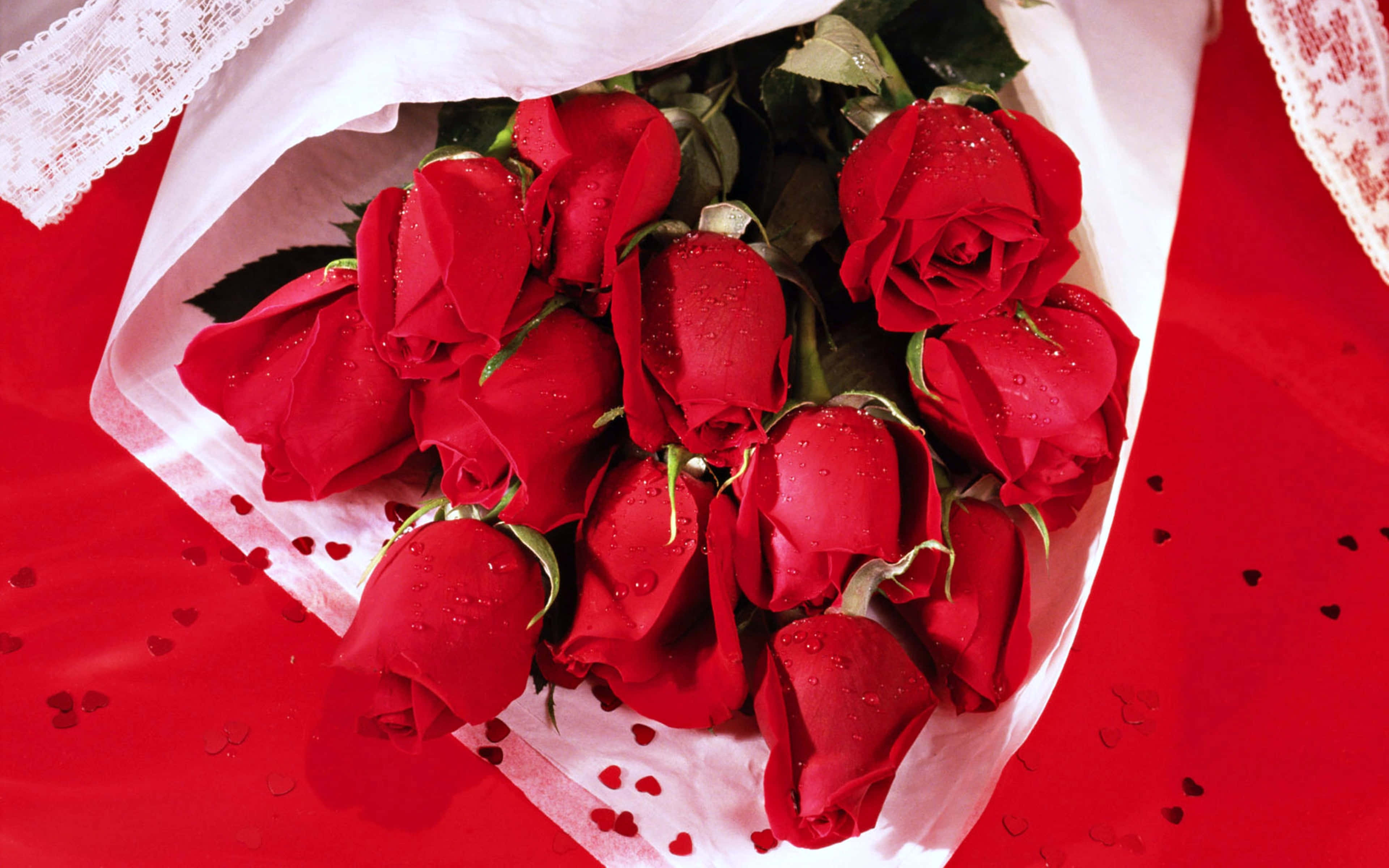 bouquet of red roses, white lace paper, red surface, 4K Desktop Wallpaper