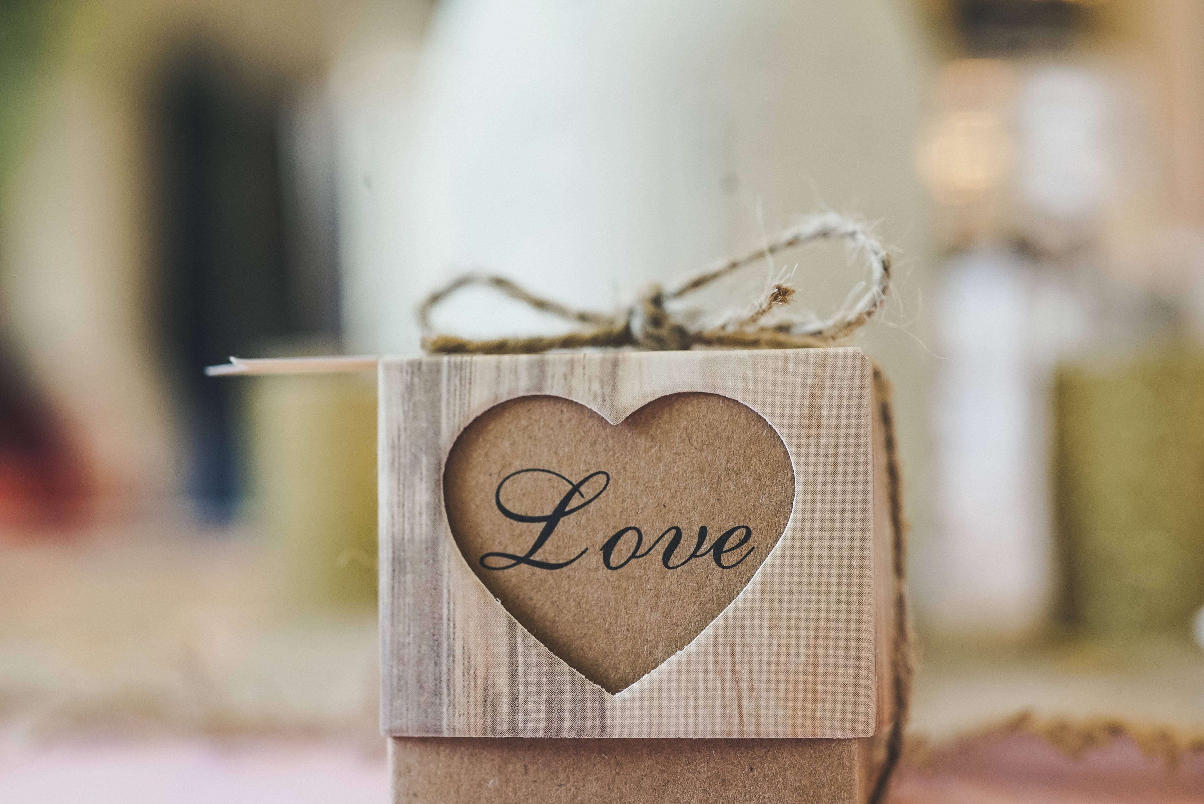 heart-shaped cutout, word 'Love' in cursive, rustic wooden box, 4K Desktop Wallpaper