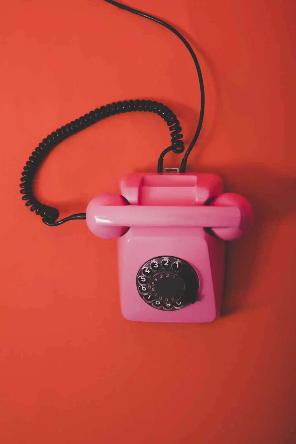 pink rotary phone, black coiled cord, bold orange background, HD Phone Wallpaper
