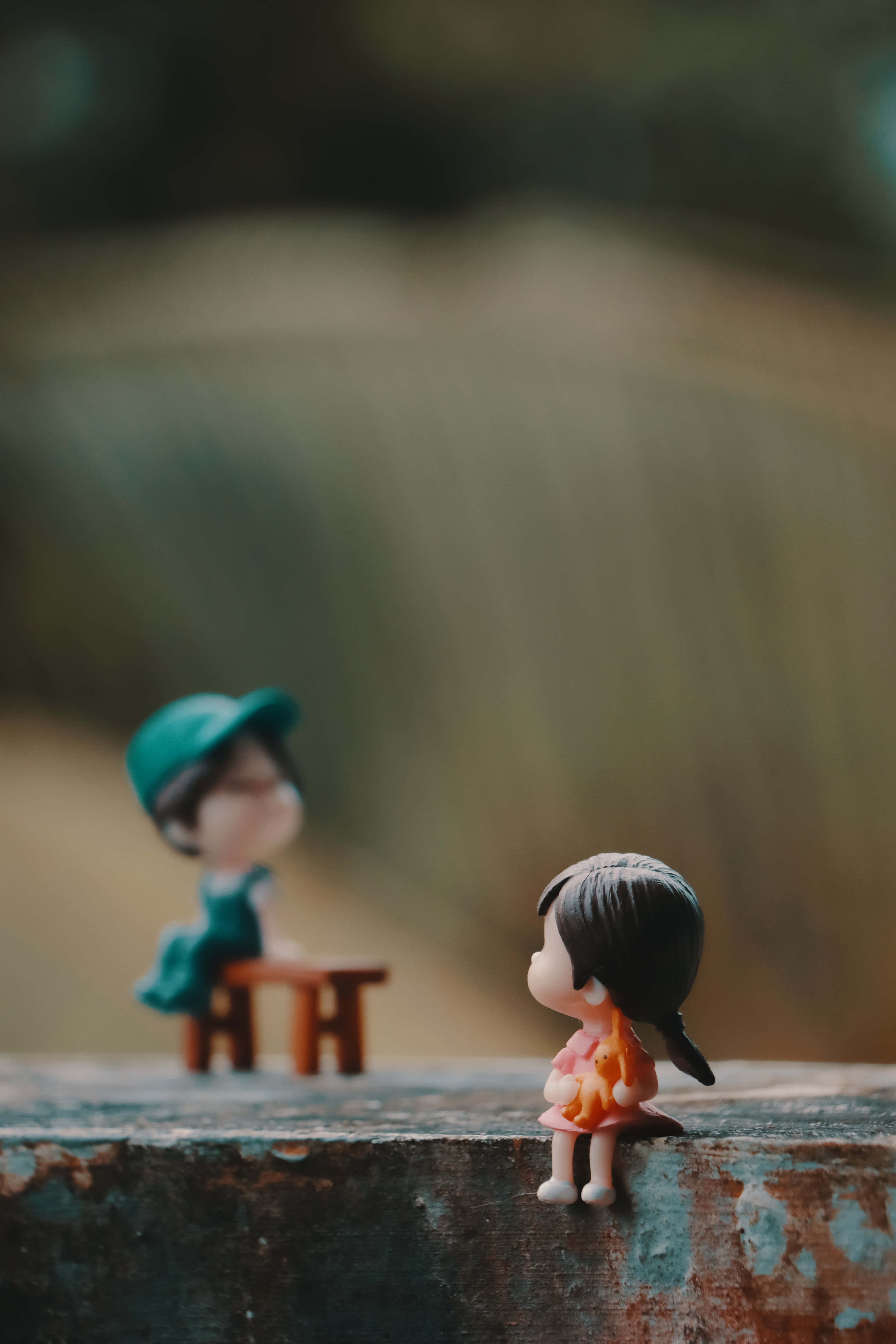 Lovely Couple Figures Apart, miniature figurines, weathered wooden surface, 5K Phone Wallpaper