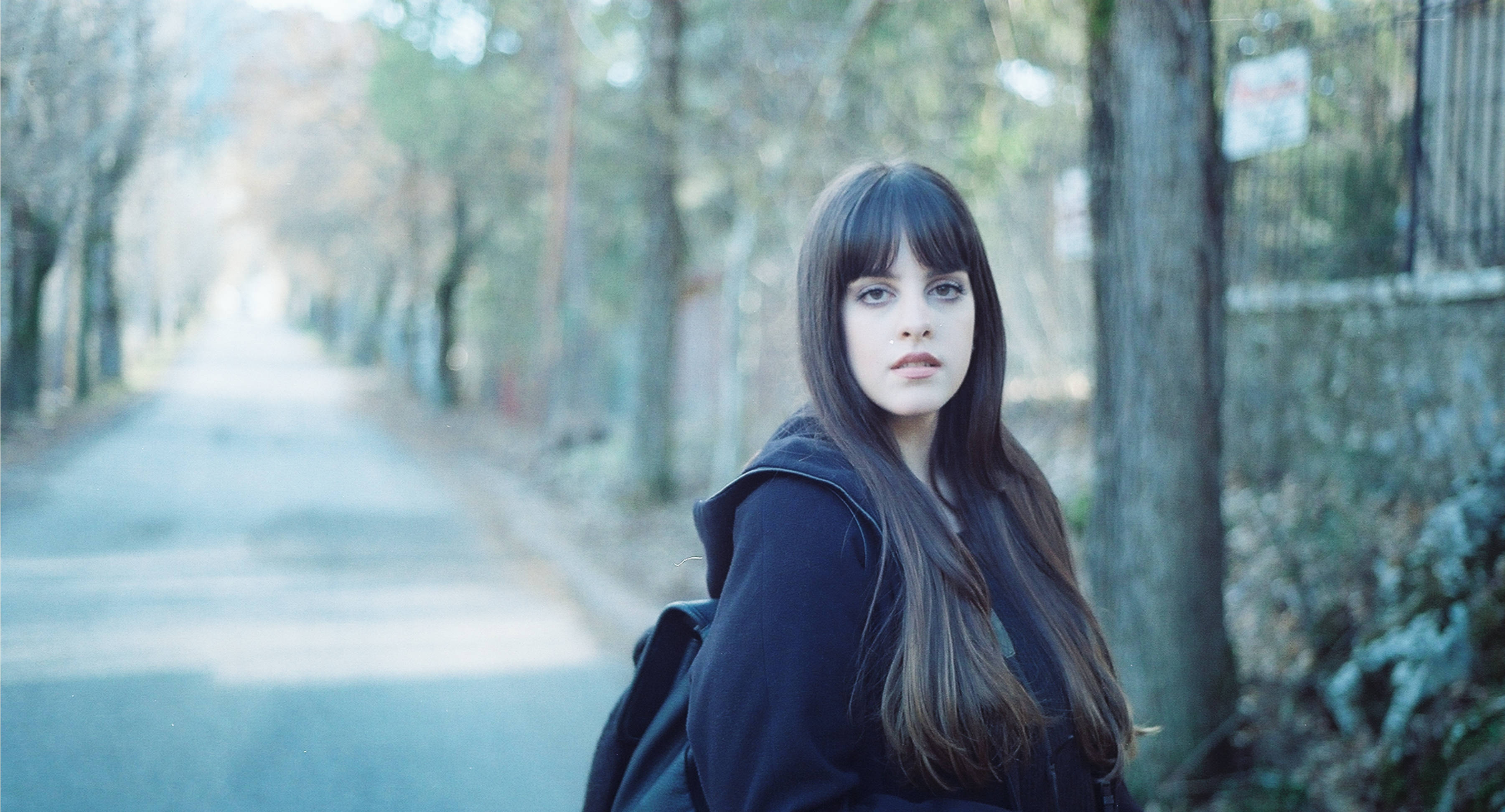 Lovely Girl With Bangs, tree-lined street, dark hoodie, 2K Desktop Wallpaper