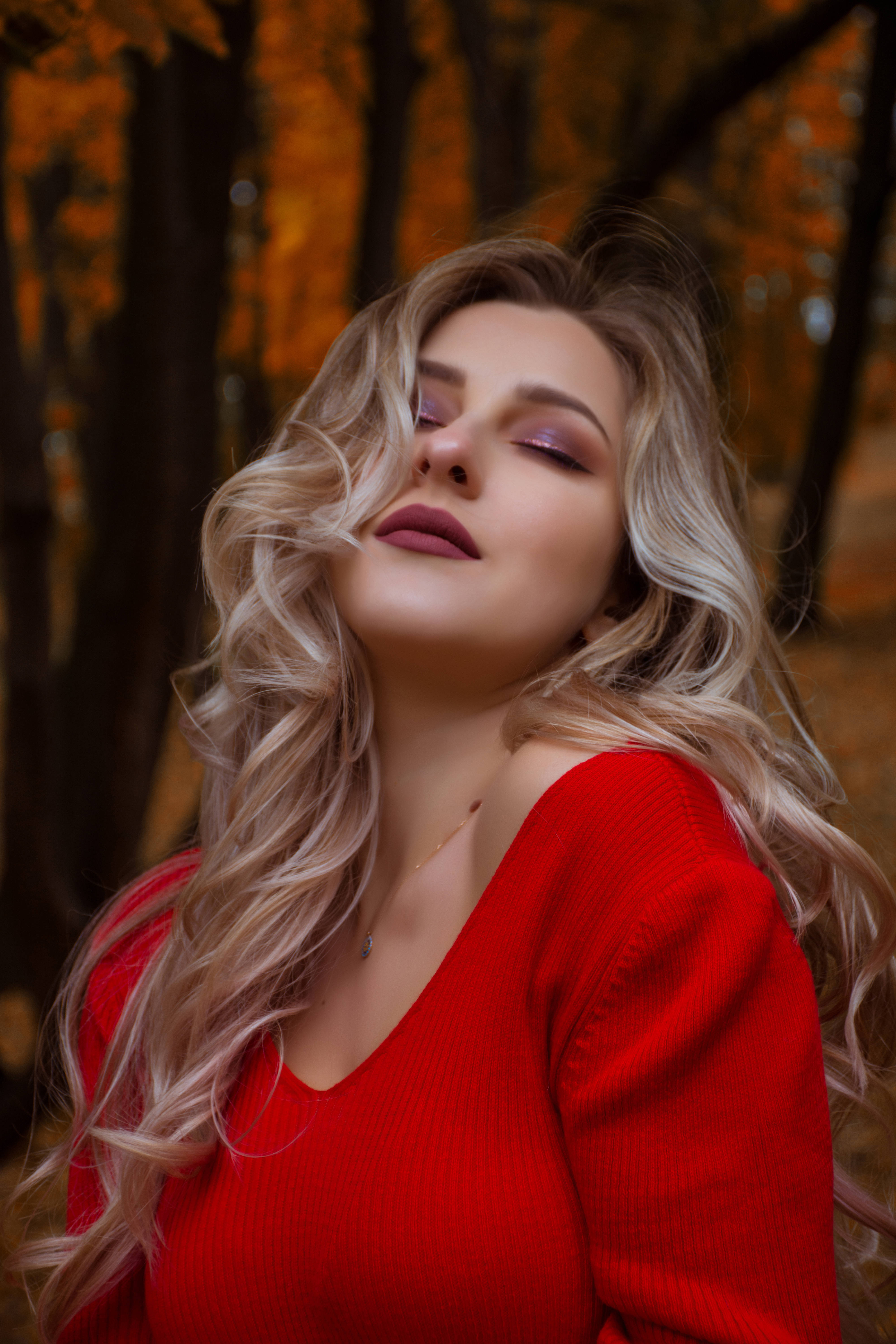red sweater, golden autumn forest, soft sunlight, 5K Phone Wallpaper