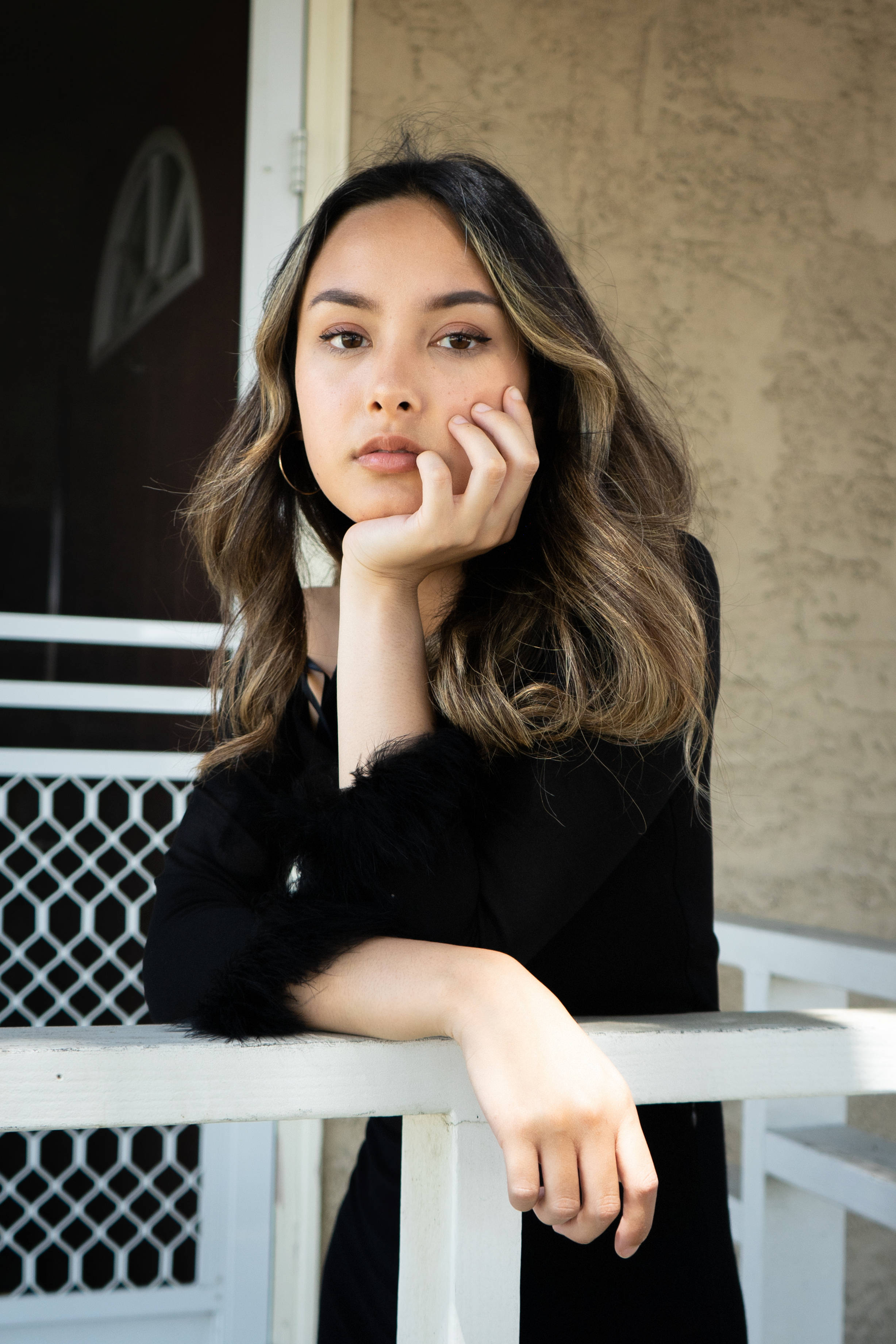 white porch railing, young woman, wavy brown hair, 2K Phone Wallpaper