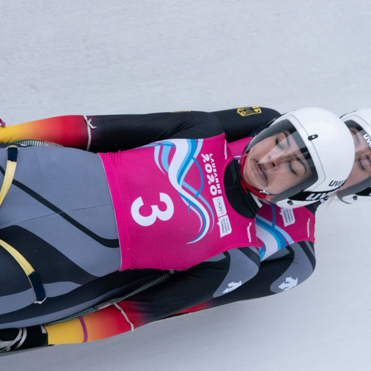 luge athletes, pink suits, snowy track, HD Desktop Wallpaper