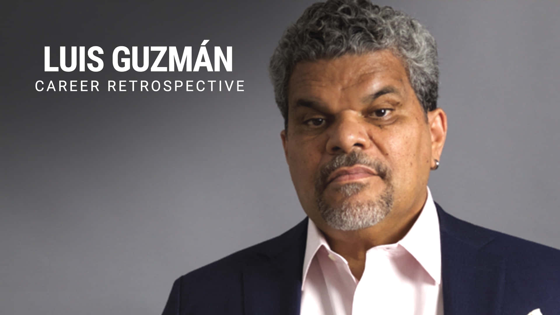 Luis Guzmán, dark suit, pink shirt, Full HD Desktop Wallpaper