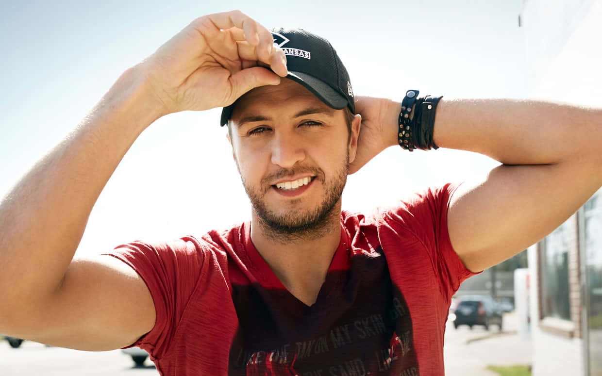 Luke Bryan, red shirt, black cap, SD Desktop Wallpaper